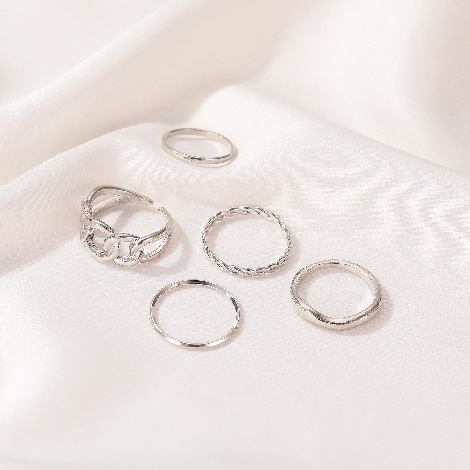 Five-Piece Ring Set featuring unique designs made from durable alloy, showcasing various sizes and styles for versatile wear.