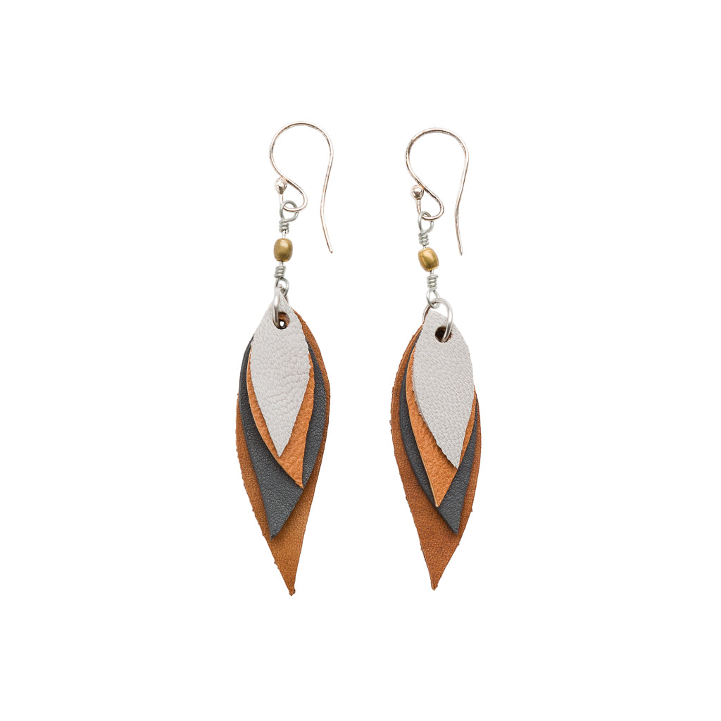 A pair of vibrant Flake Recycled Leather Earrings featuring a delicate leaf design, handcrafted from colorful leather offcuts.