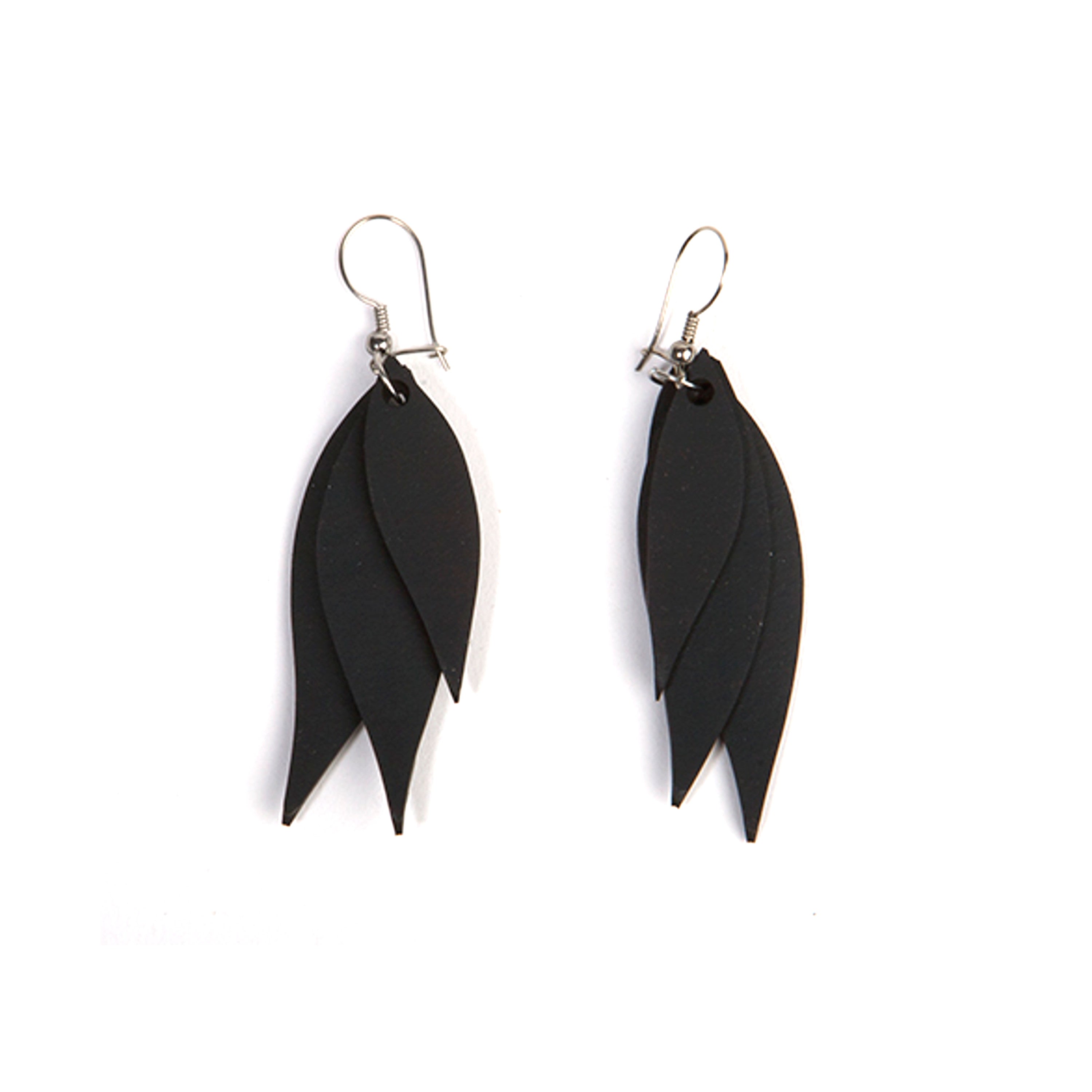 A pair of Flake Recycled Rubber Earrings showcasing unique patterns and textures, handcrafted from reclaimed tyre inner tubes.