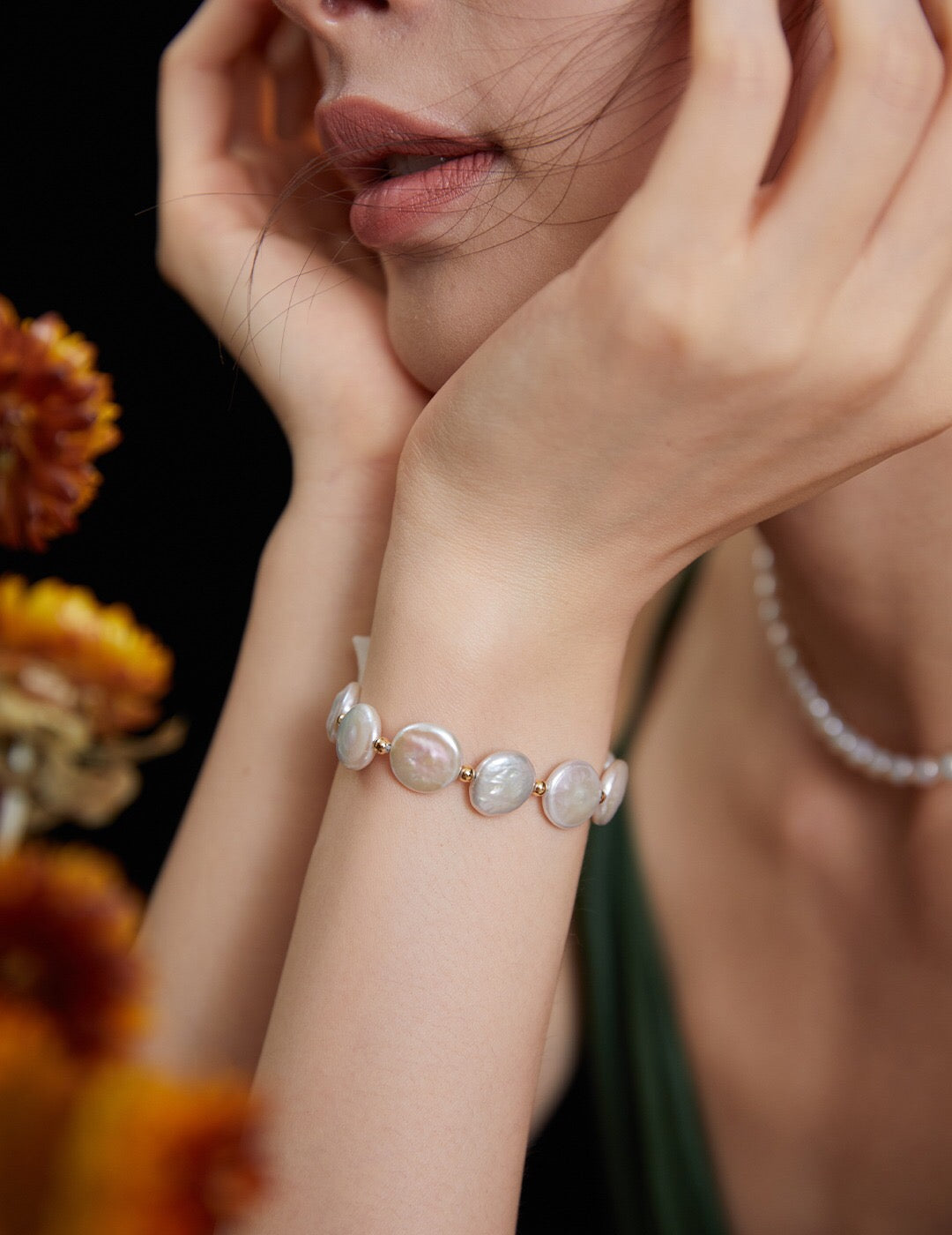 Flat Coin Pearl Bracelet featuring natural freshwater pearls and gold vermeil, elegantly displayed on a soft surface.