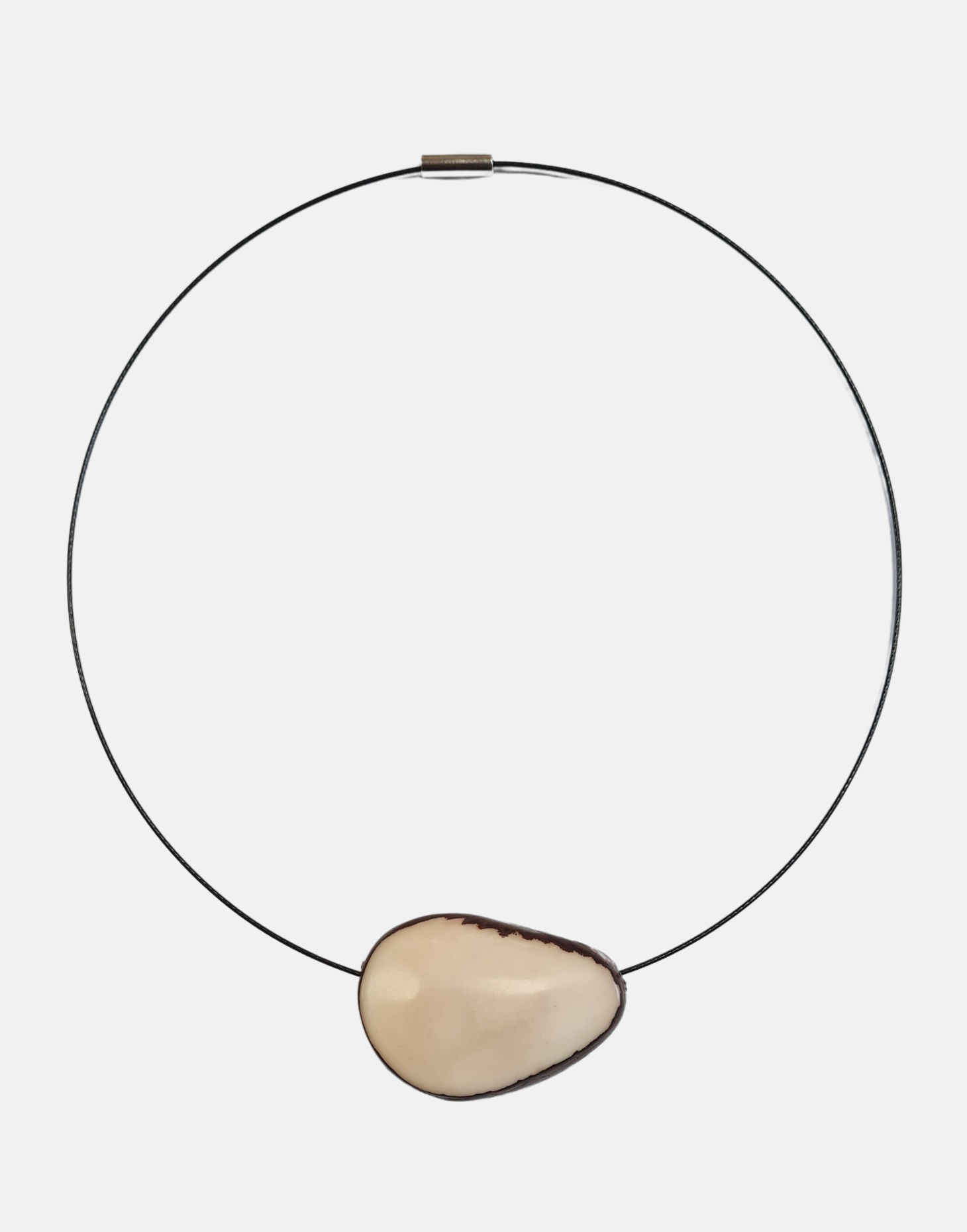 A beautifully crafted Flattened Seed Wire Necklace featuring a colored nut focal point on a black stainless steel wire.