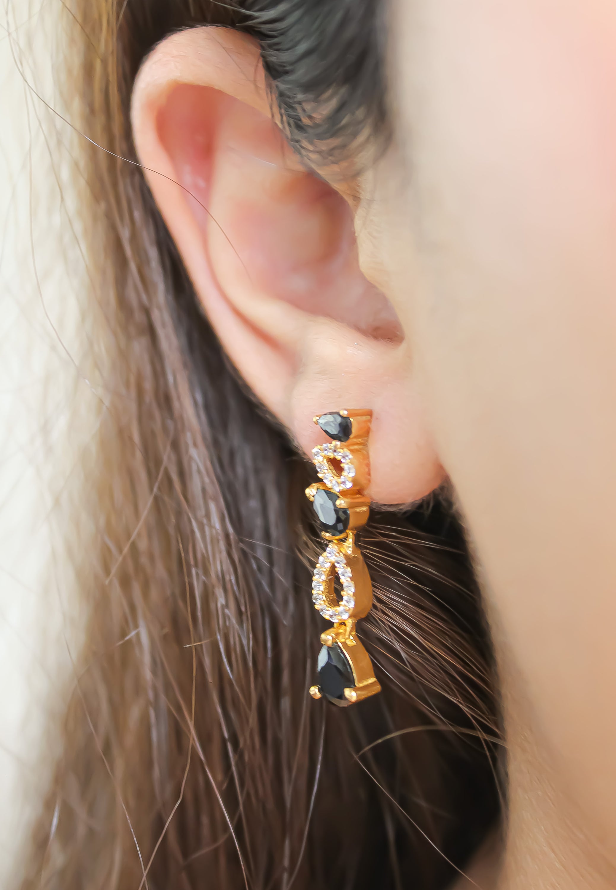 Elegant Florence Earrings featuring 18K gold plating and 21 sparkling zirconia stones, perfect for sensitive ears.