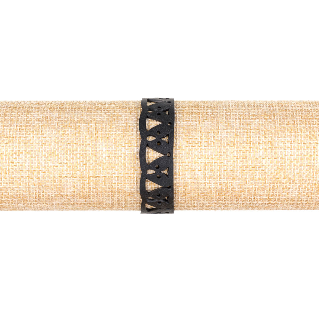 Florence Thin Inner Tube Bracelet made from recycled rubber with a geometric wave design, showcasing its unique texture and slimline style.