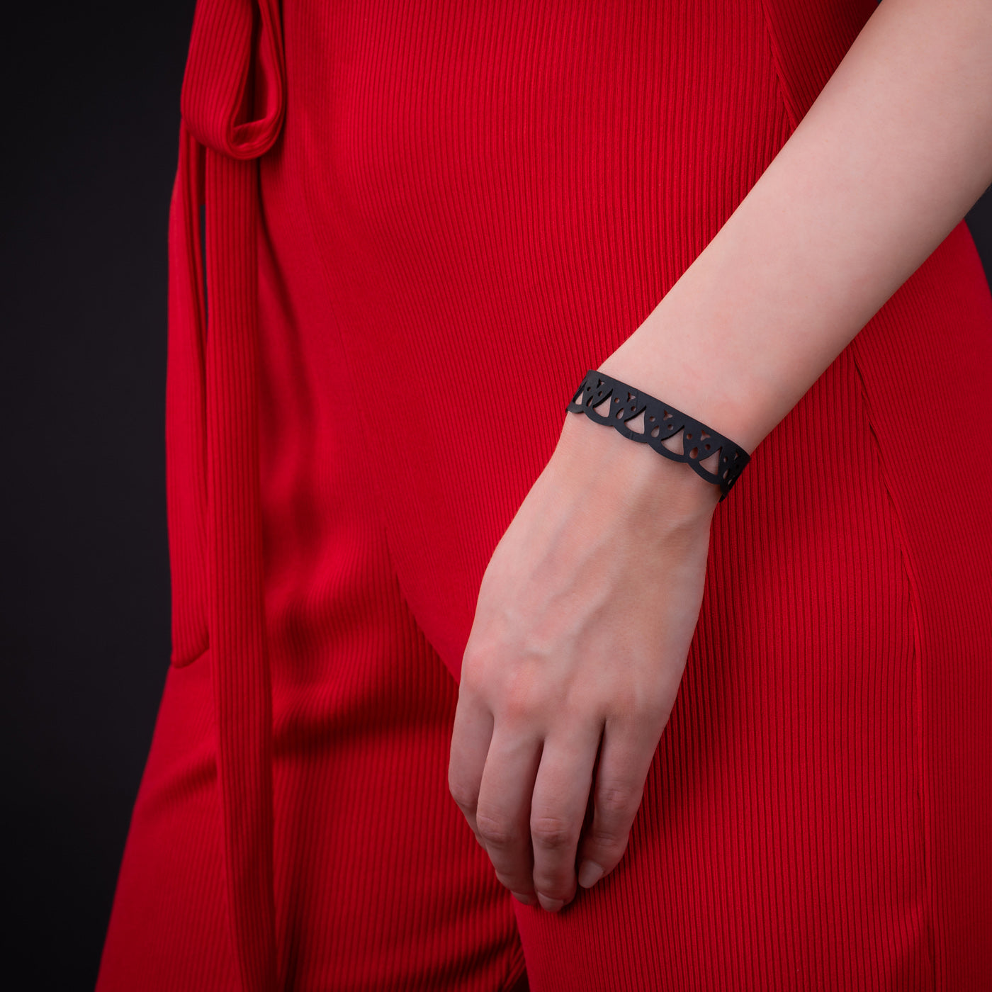 Florence Thin Inner Tube Bracelet made from recycled rubber with a geometric wave design, showcasing its unique texture and slimline style.