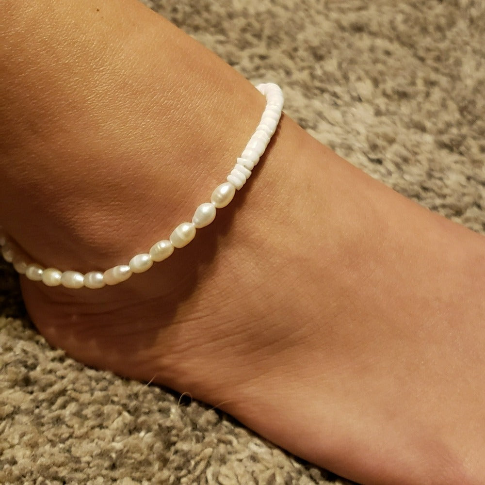 Flores Puka & Anklet Ankle Bracelet featuring puka shells and freshwater pearls, handmade in Bali.