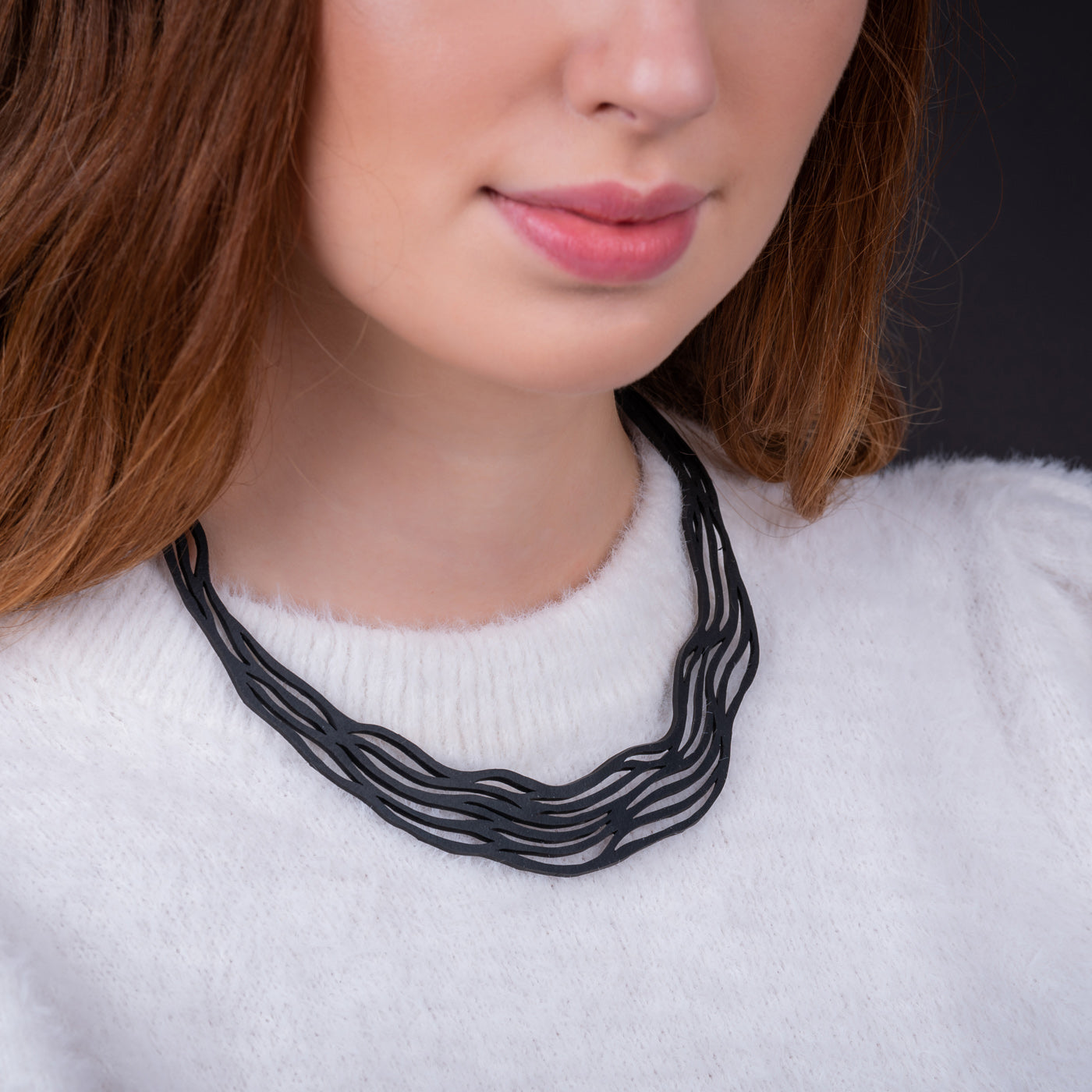 Flow Elegant Recycled Rubber Necklace showcasing a natural flowing pattern, handcrafted from reclaimed tyre inner tubes.