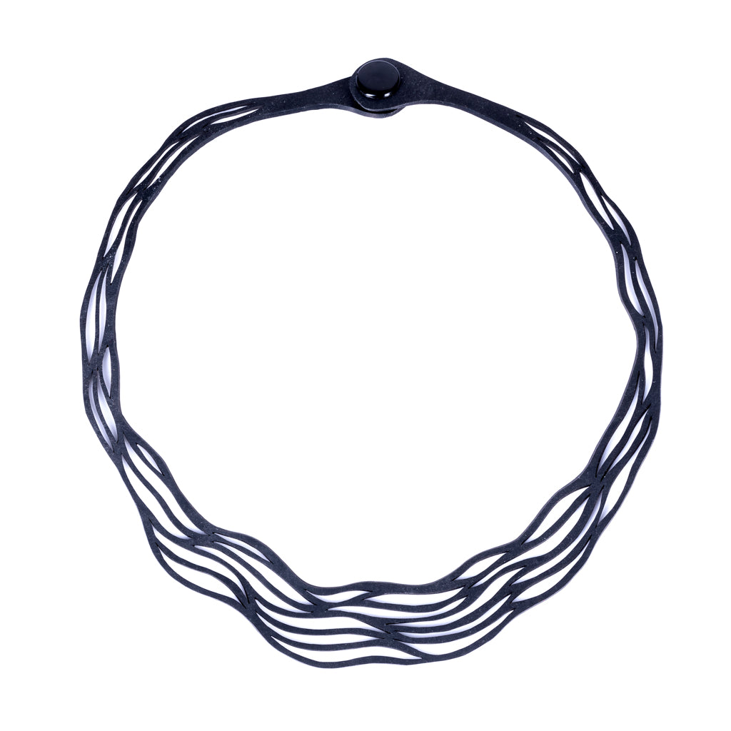 Flow Elegant Recycled Rubber Necklace showcasing a natural flowing pattern, handcrafted from reclaimed tyre inner tubes.