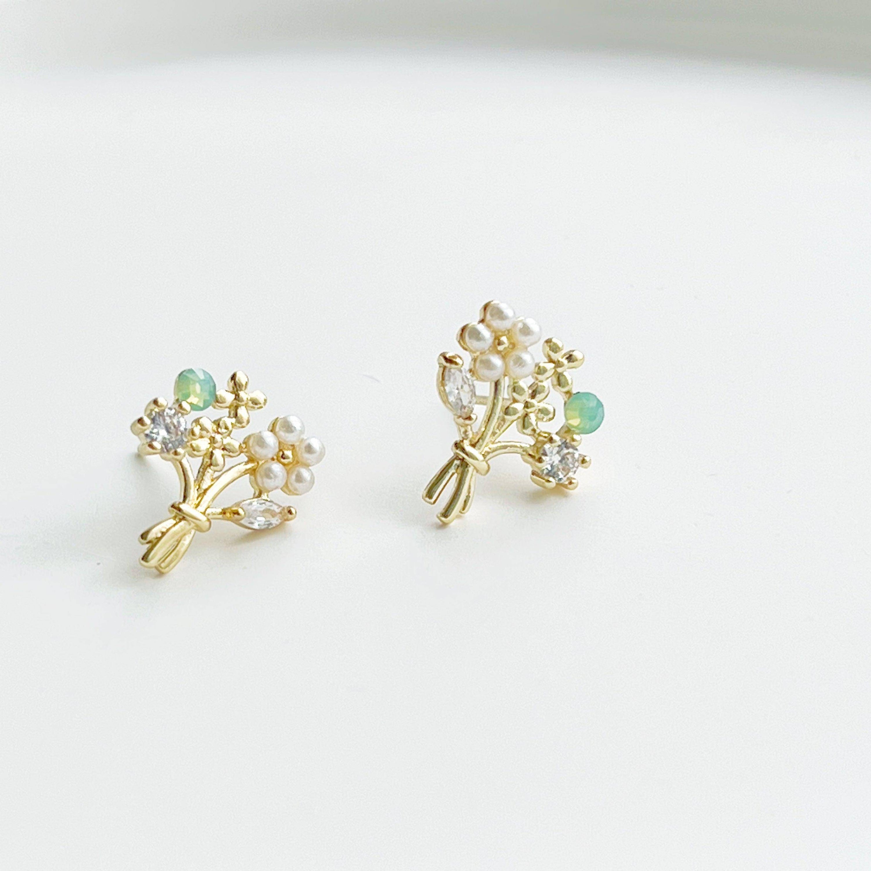 Elegant Flower Bouquet Earrings featuring gold flowers and green crystal studs, beautifully designed for celebrations.