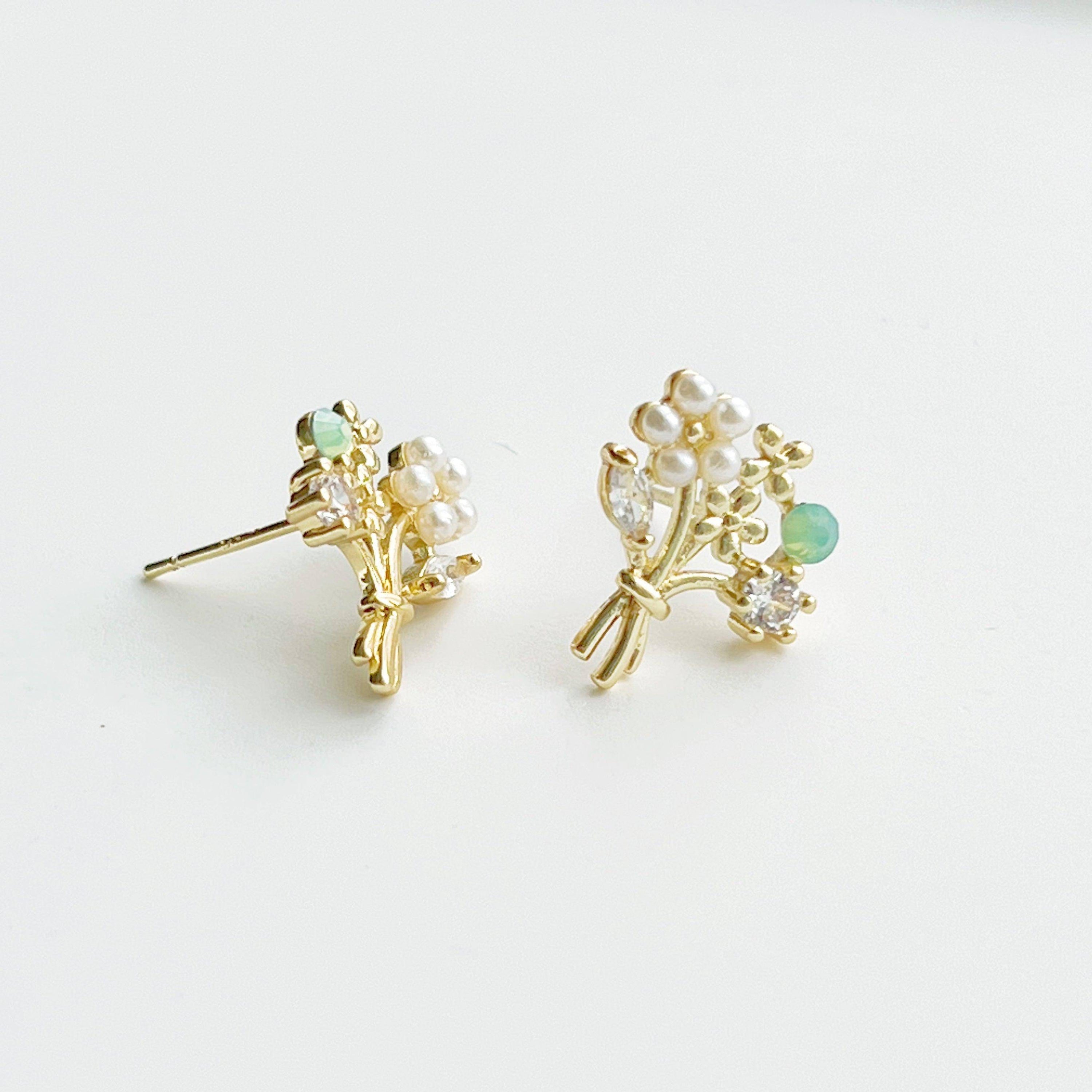 Elegant Flower Bouquet Earrings featuring gold flowers and green crystal studs, beautifully designed for celebrations.