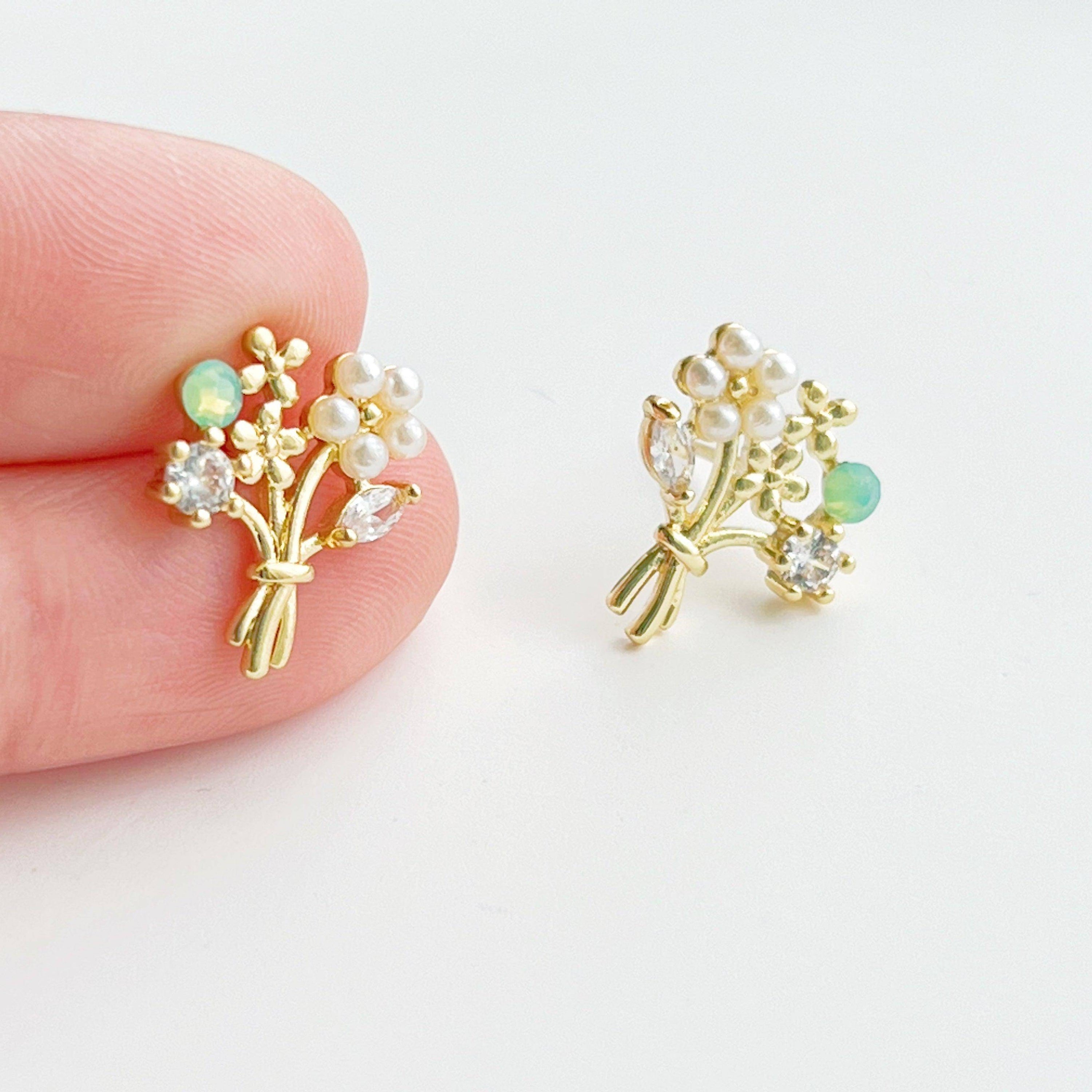 Elegant Flower Bouquet Earrings featuring gold flowers and green crystal studs, beautifully designed for celebrations.