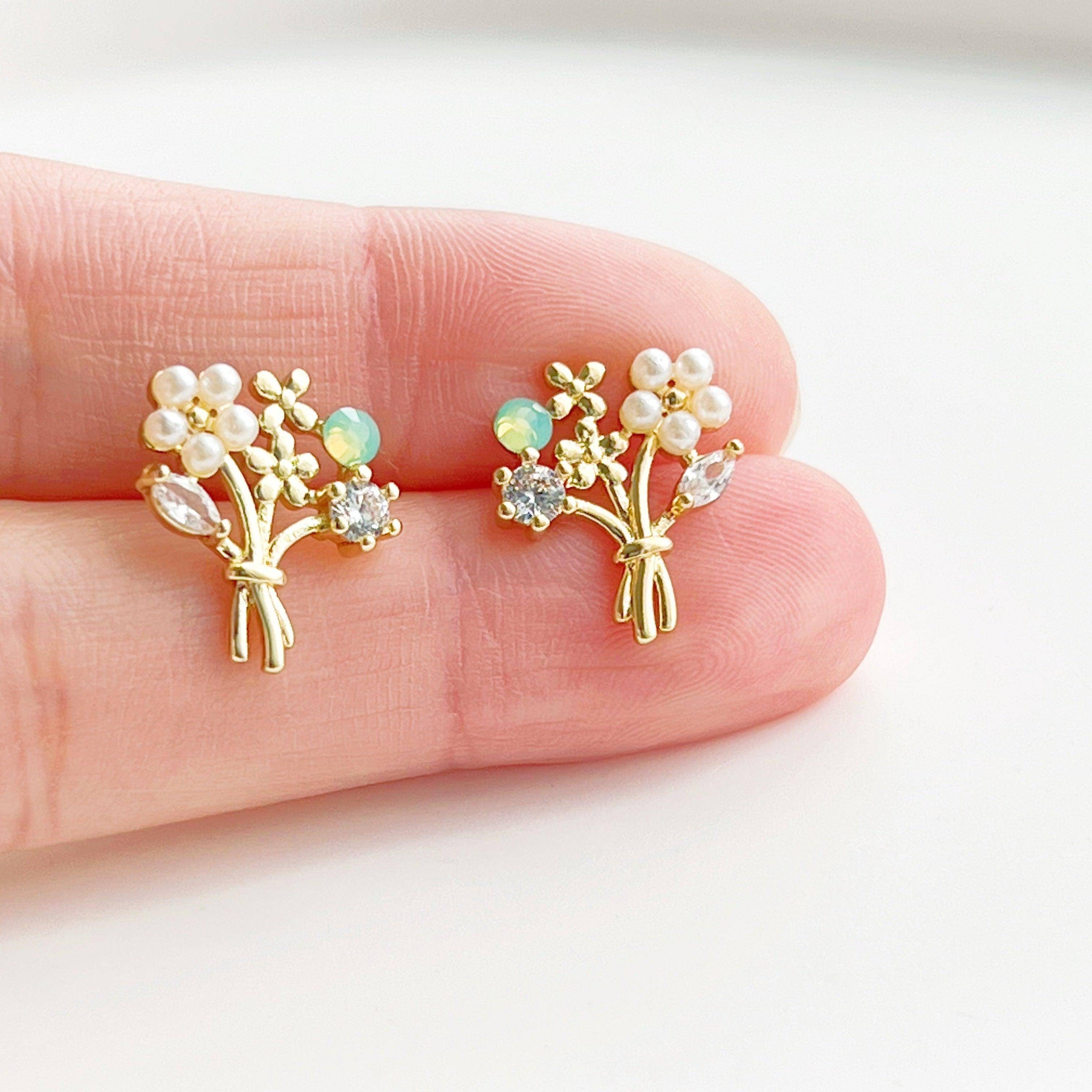 Elegant Flower Bouquet Earrings featuring gold flowers and green crystal studs, beautifully designed for celebrations.