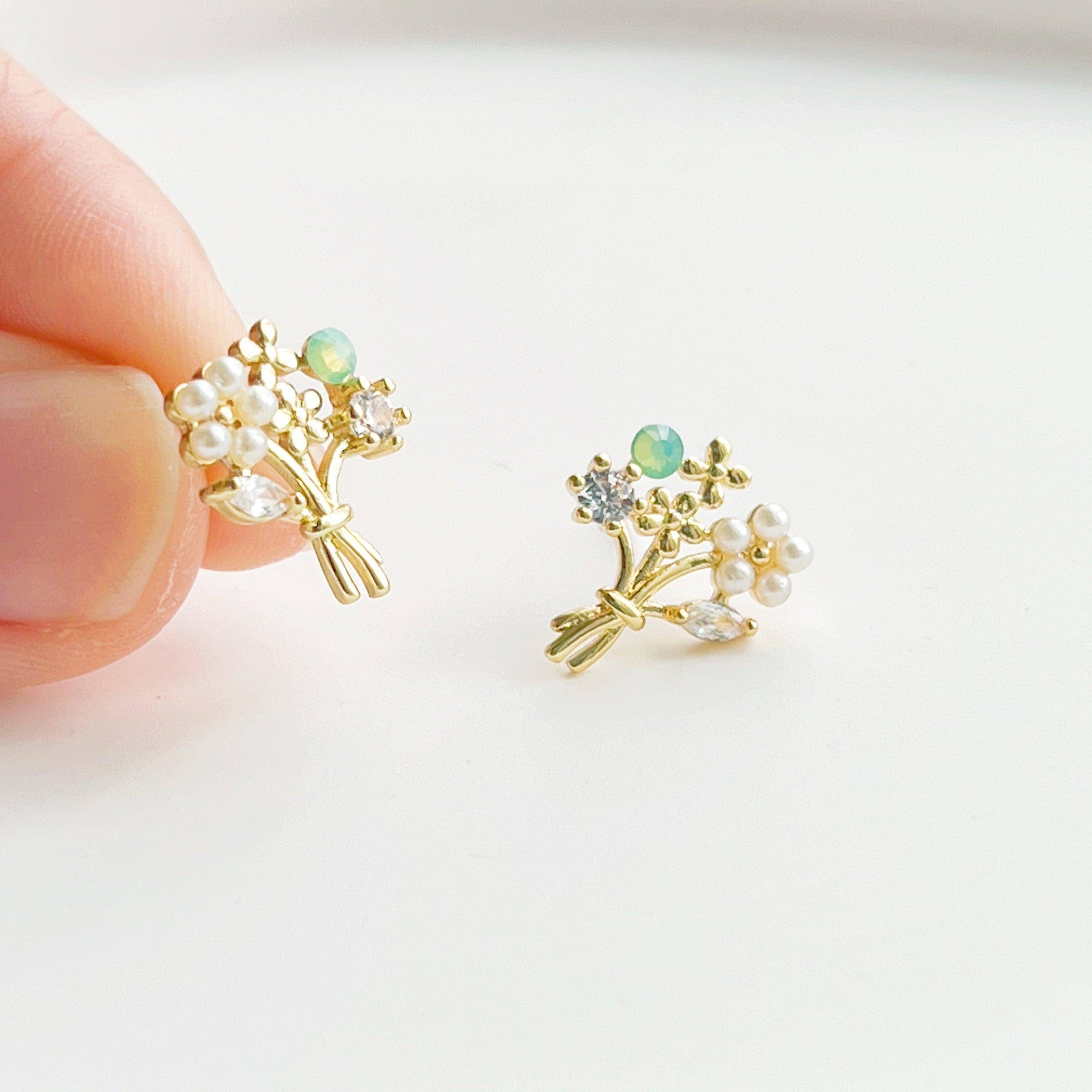 Elegant Flower Bouquet Earrings featuring gold flowers and green crystal studs, beautifully designed for celebrations.