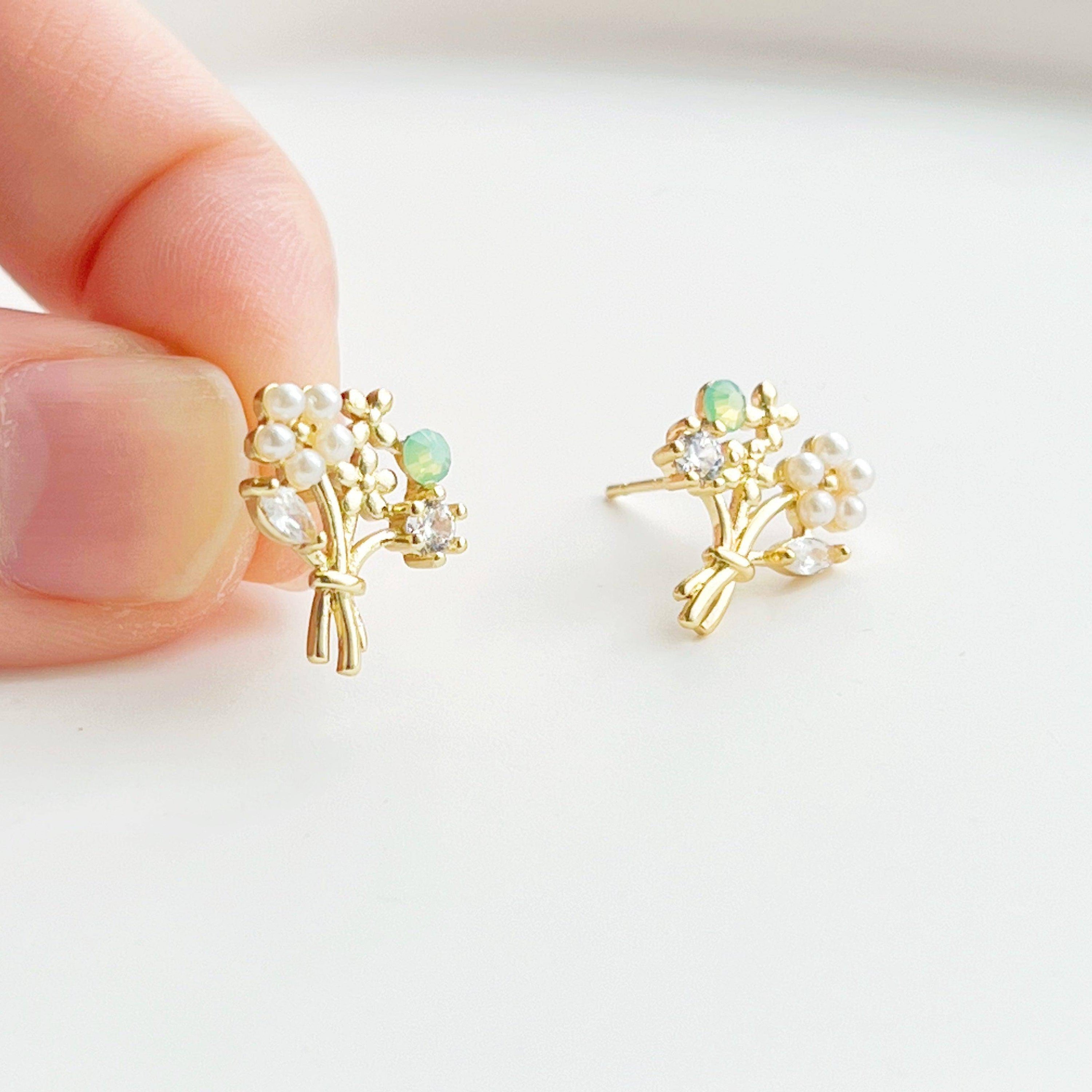 Elegant Flower Bouquet Earrings featuring gold flowers and green crystal studs, beautifully designed for celebrations.