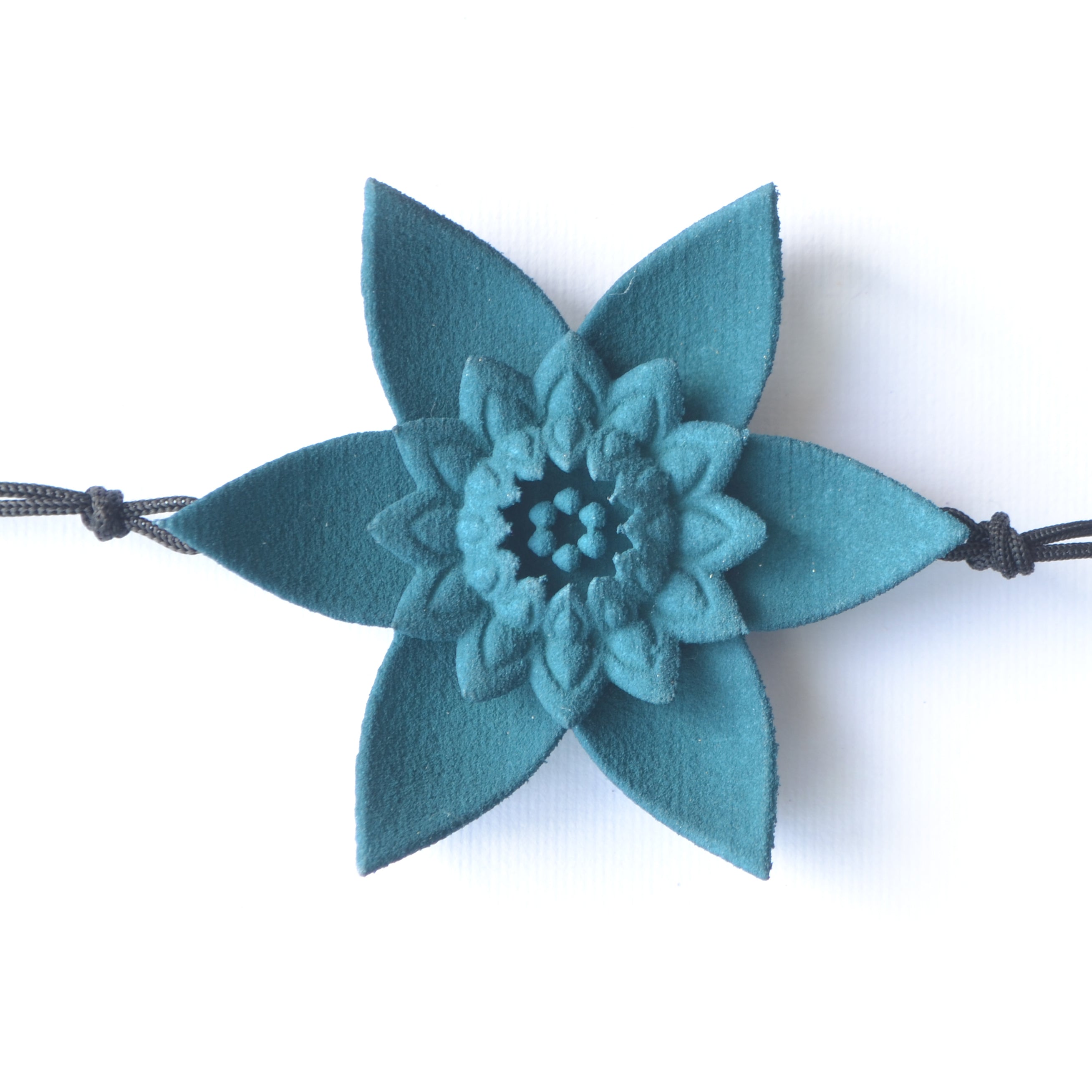 A beautiful Dahlia Flower Bracelet featuring a large flower design made of ultra-light nylon and sterling silver accents.