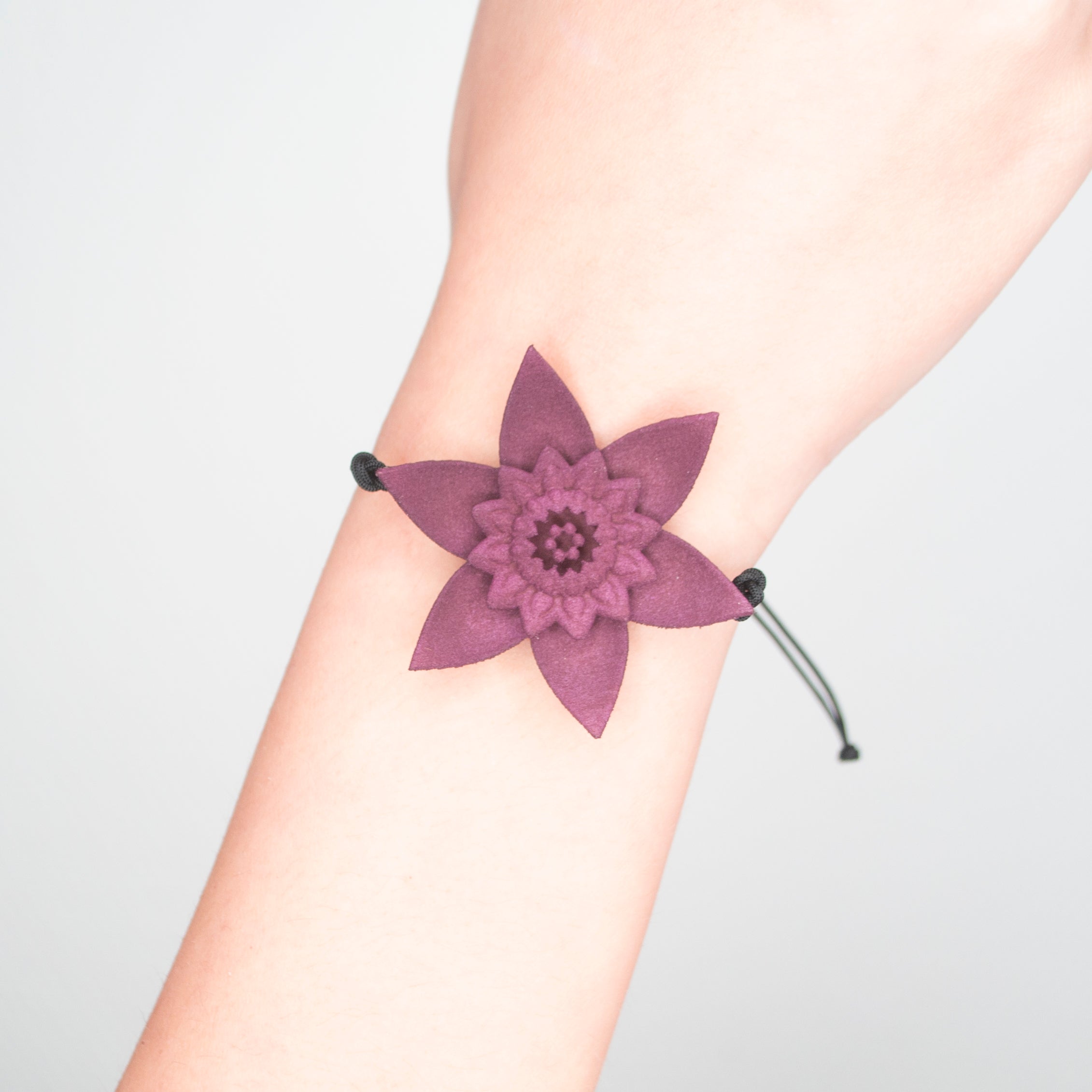 A beautiful Dahlia Flower Bracelet featuring a large flower design made of ultra-light nylon and sterling silver accents.