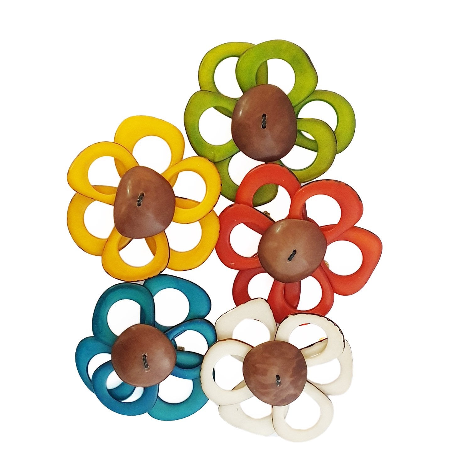 A delicate flower brooch designed as a daisy, made from slices of tagua, showcasing natural variations in color and texture.