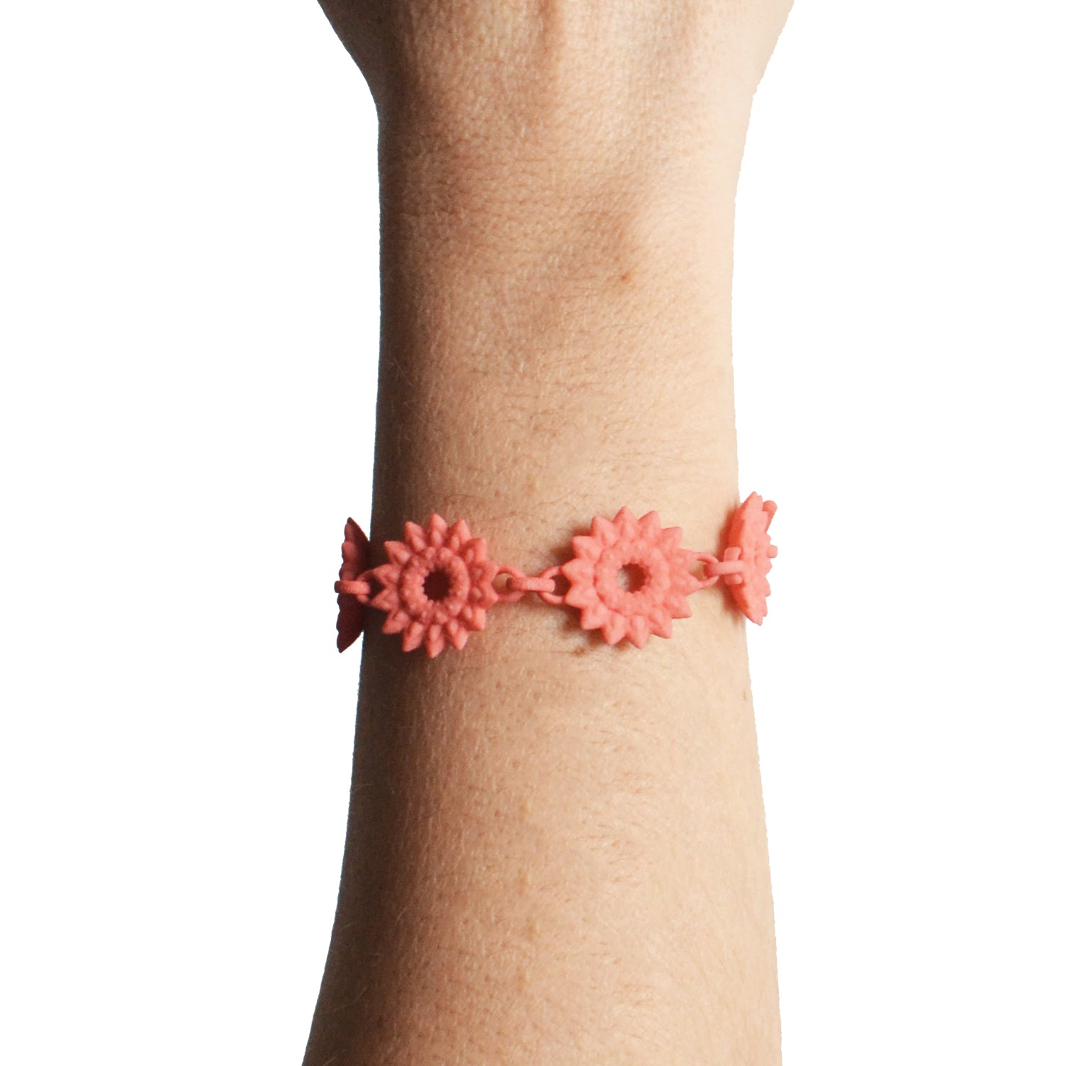 A vibrant Flower Chain Bracelet featuring delicate dahlia flowers, crafted from lightweight nylon material with a toggle clasp.