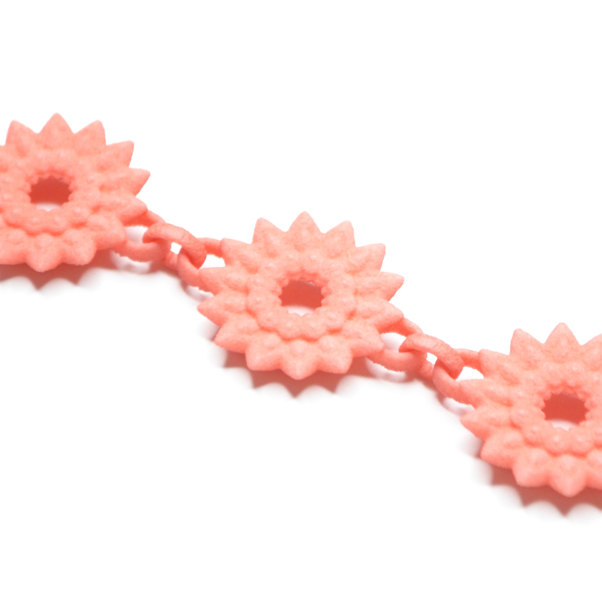 A vibrant Flower Chain Bracelet featuring delicate dahlia flowers, crafted from lightweight nylon material with a toggle clasp.