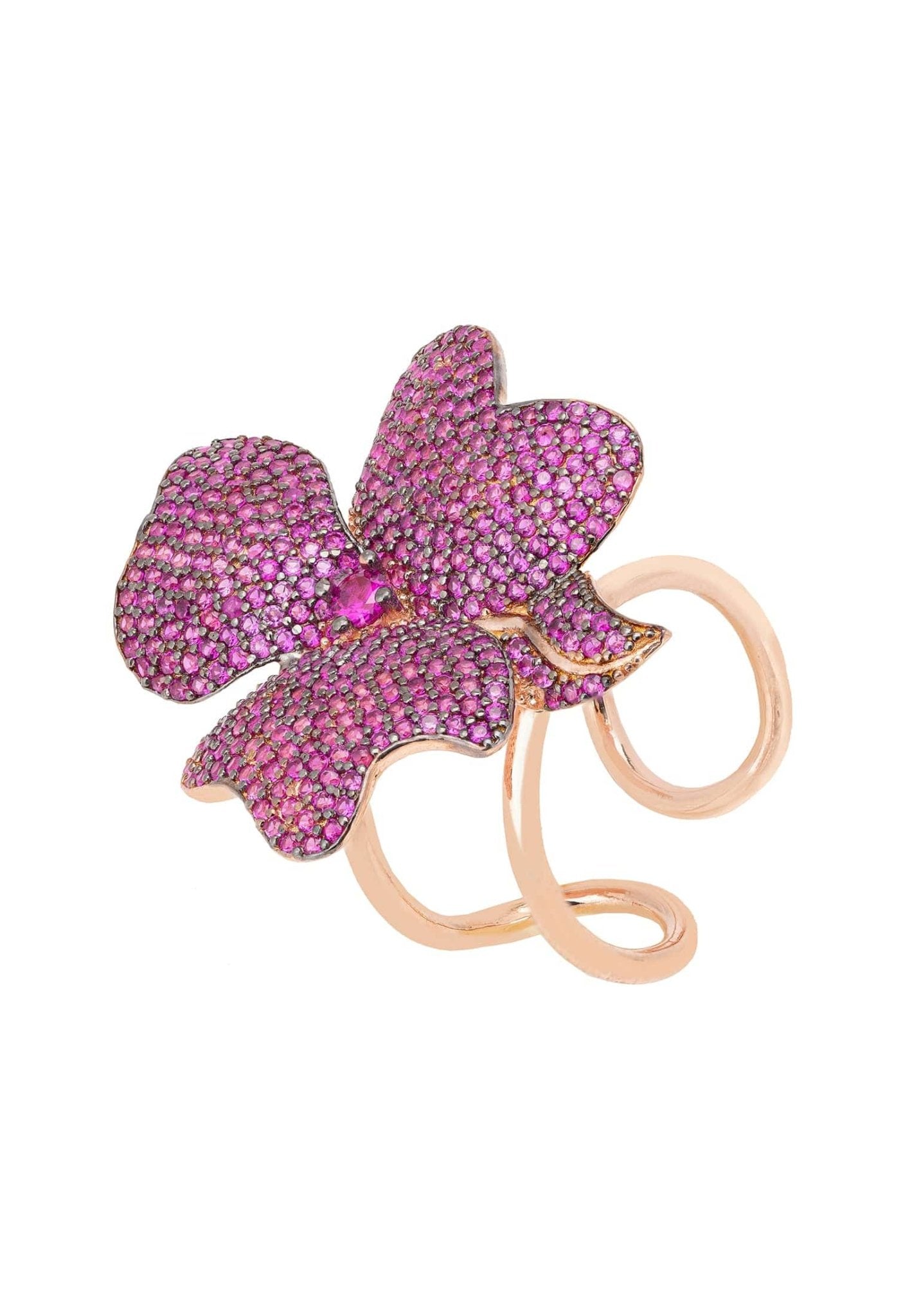 Flower Cocktail Ring in Rosegold featuring a large flower motif adorned with ruby cubic zirconia on adjustable metallic bands.