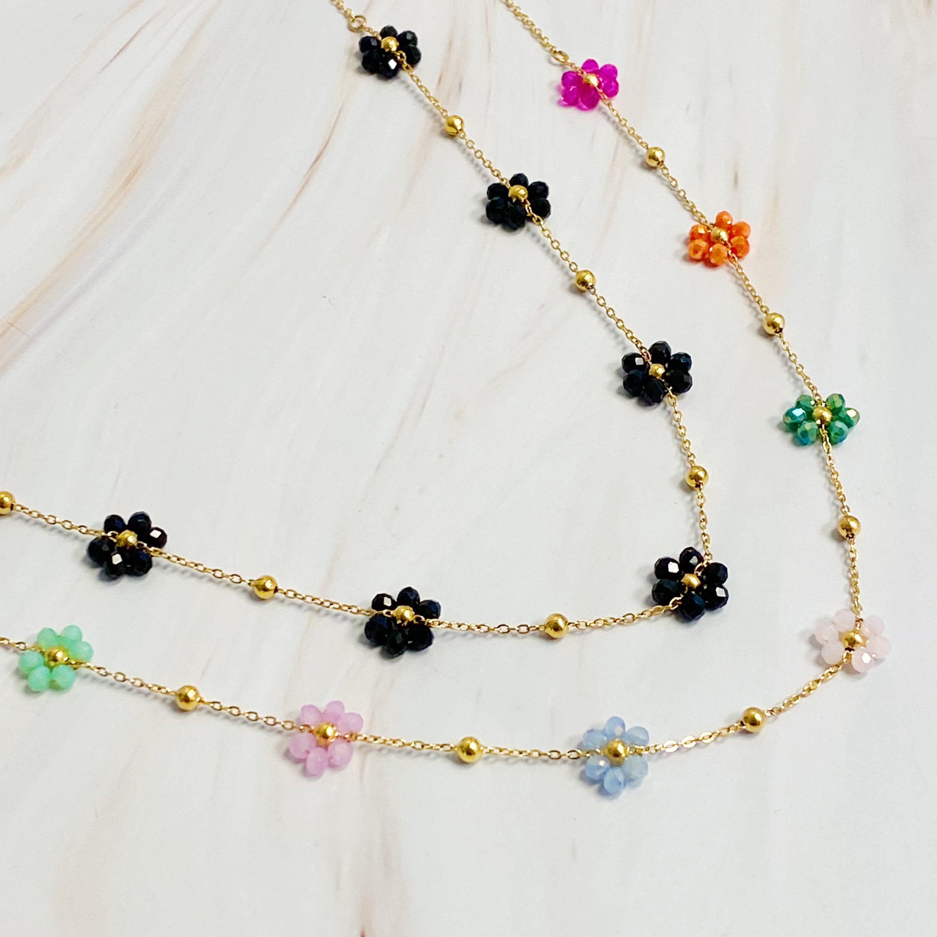 Flower Field Romance Beaded Necklace featuring colorful flowers on a dainty gold chain, perfect for layering.