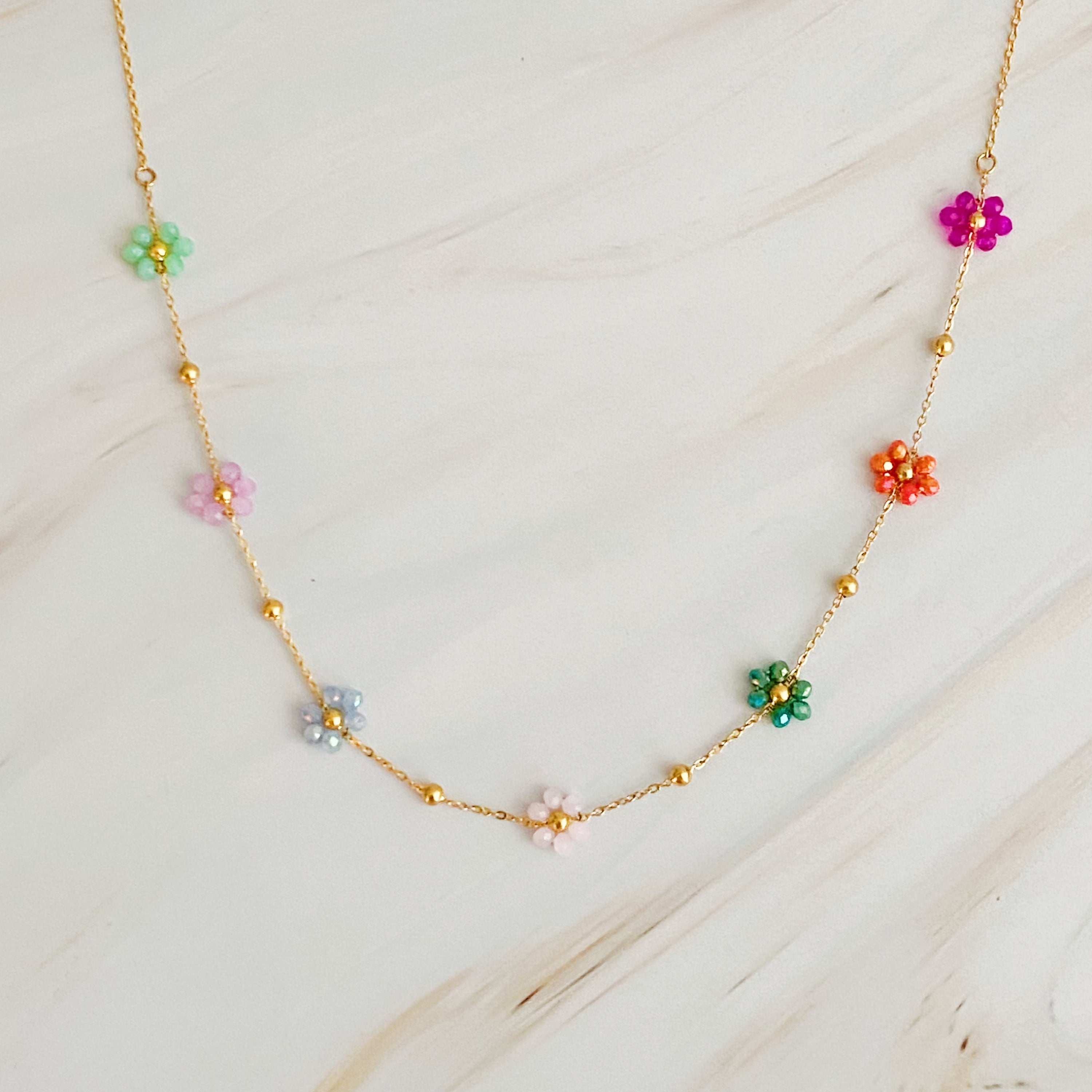 Flower Field Romance Beaded Necklace featuring colorful flowers on a dainty gold chain, perfect for layering.