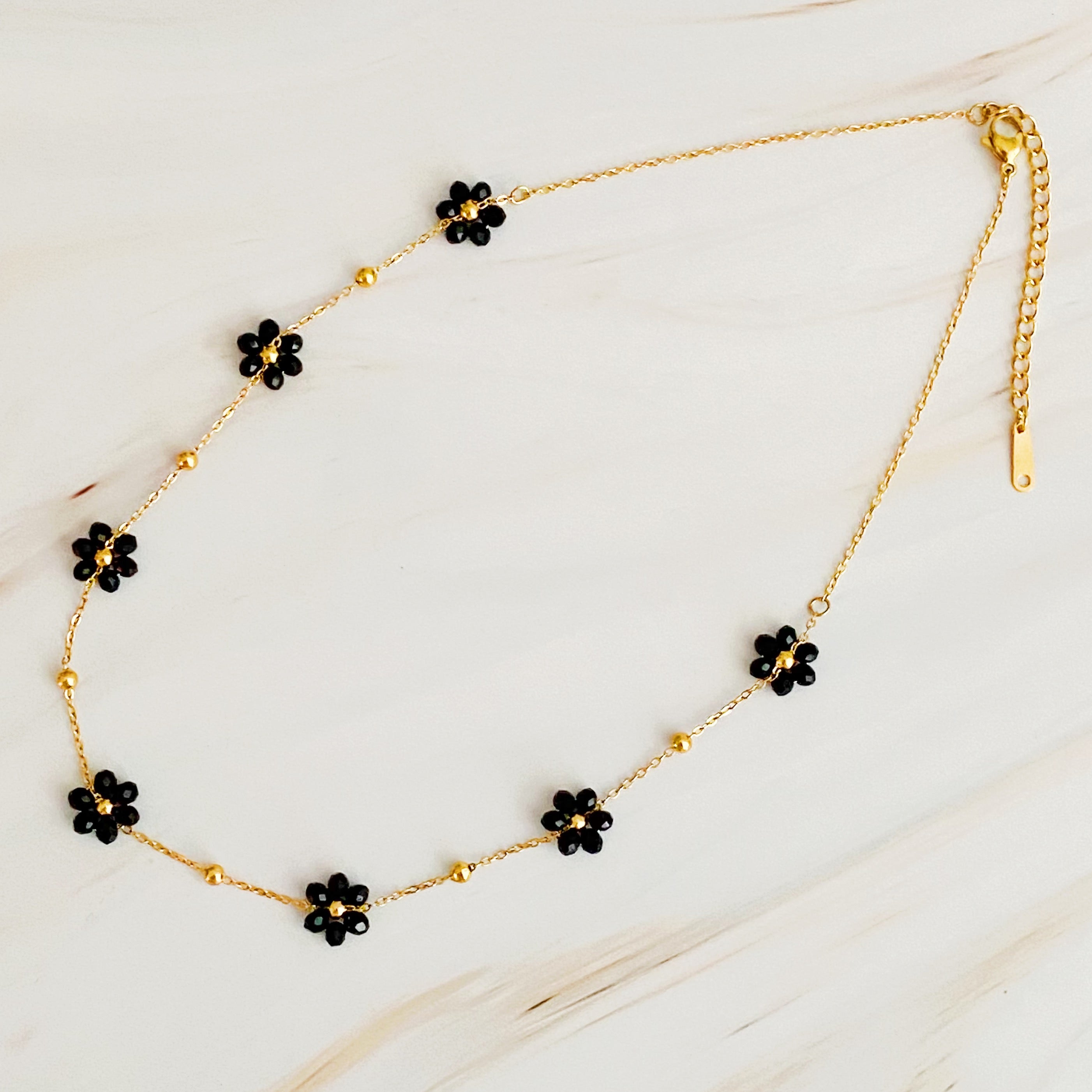 Flower Field Romance Beaded Necklace featuring colorful flowers on a dainty gold chain, perfect for layering.