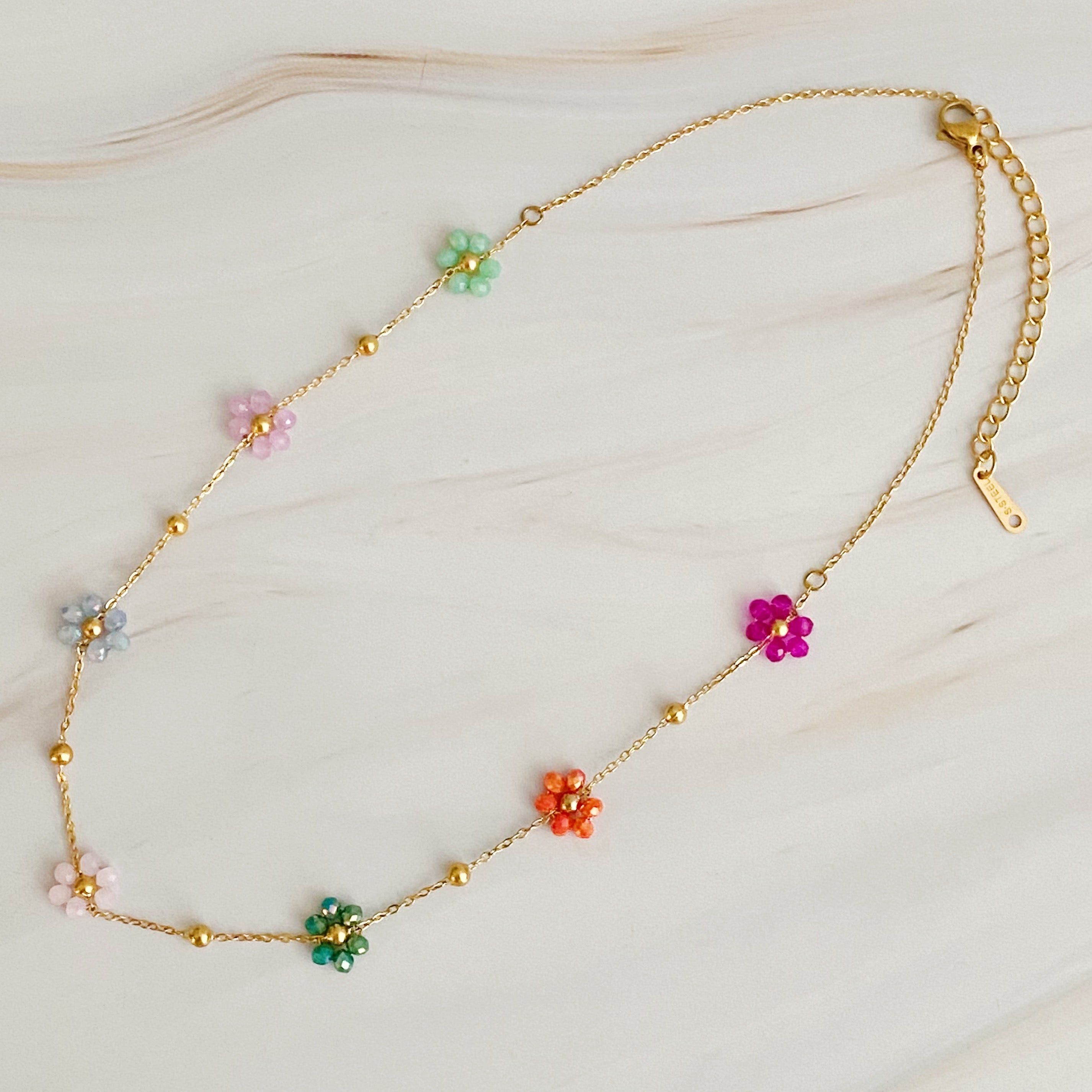 Flower Field Romance Beaded Necklace featuring colorful flowers on a dainty gold chain, perfect for layering.