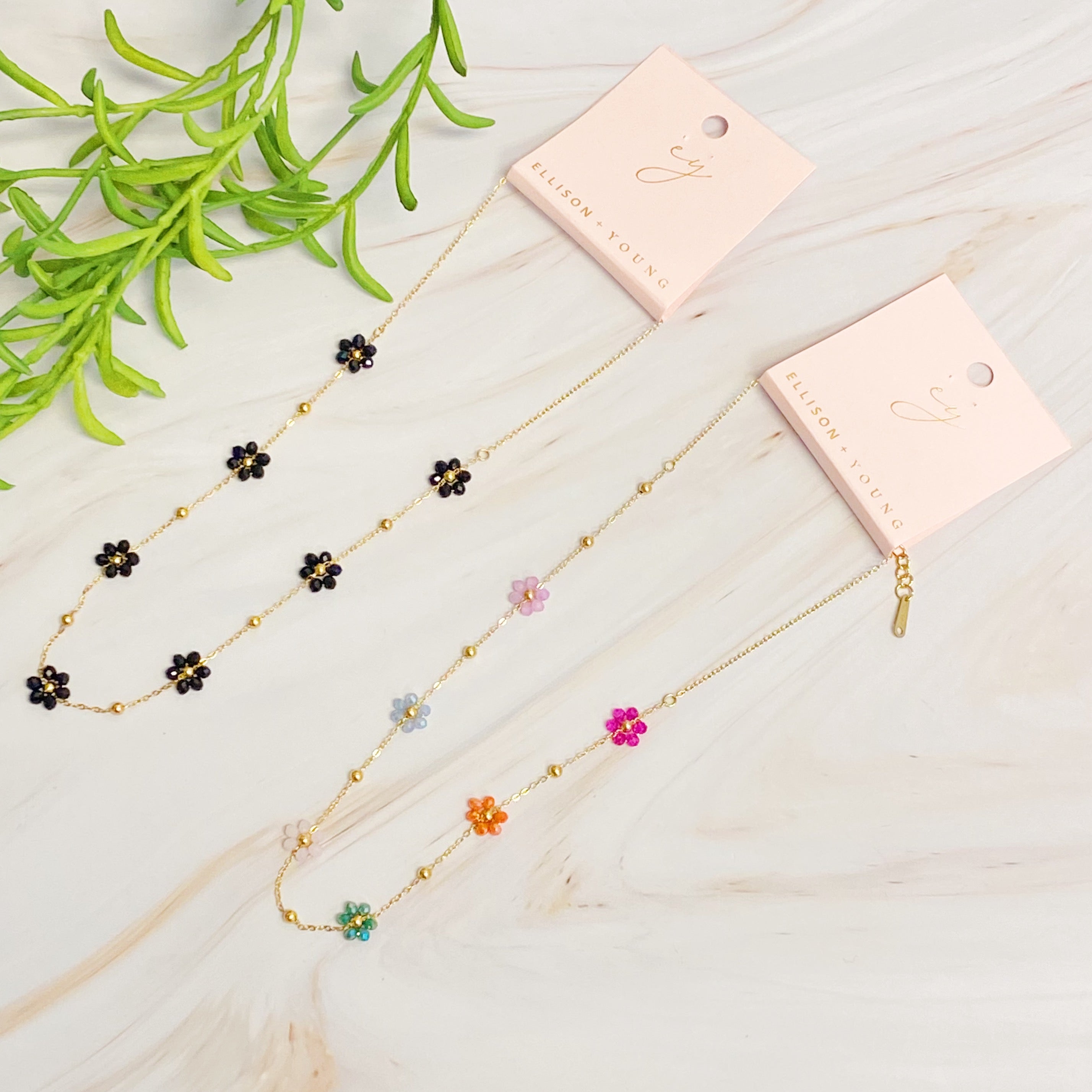 Flower Field Romance Beaded Necklace featuring colorful flowers on a dainty gold chain, perfect for layering.