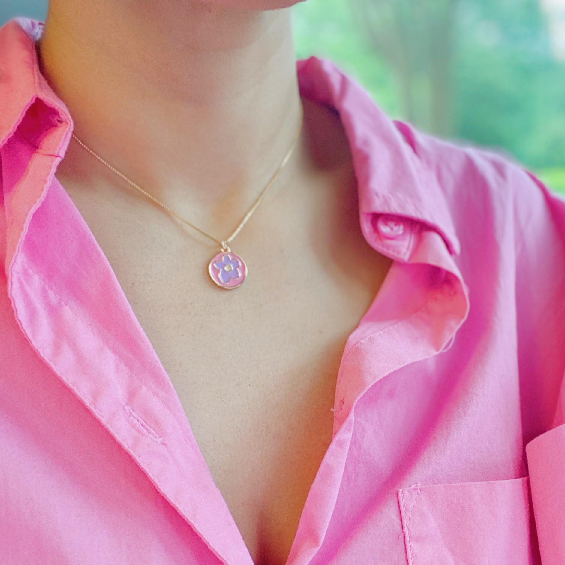 A delicate Flower Lover Necklace featuring a colorful flower pendant on a gold plated chain.