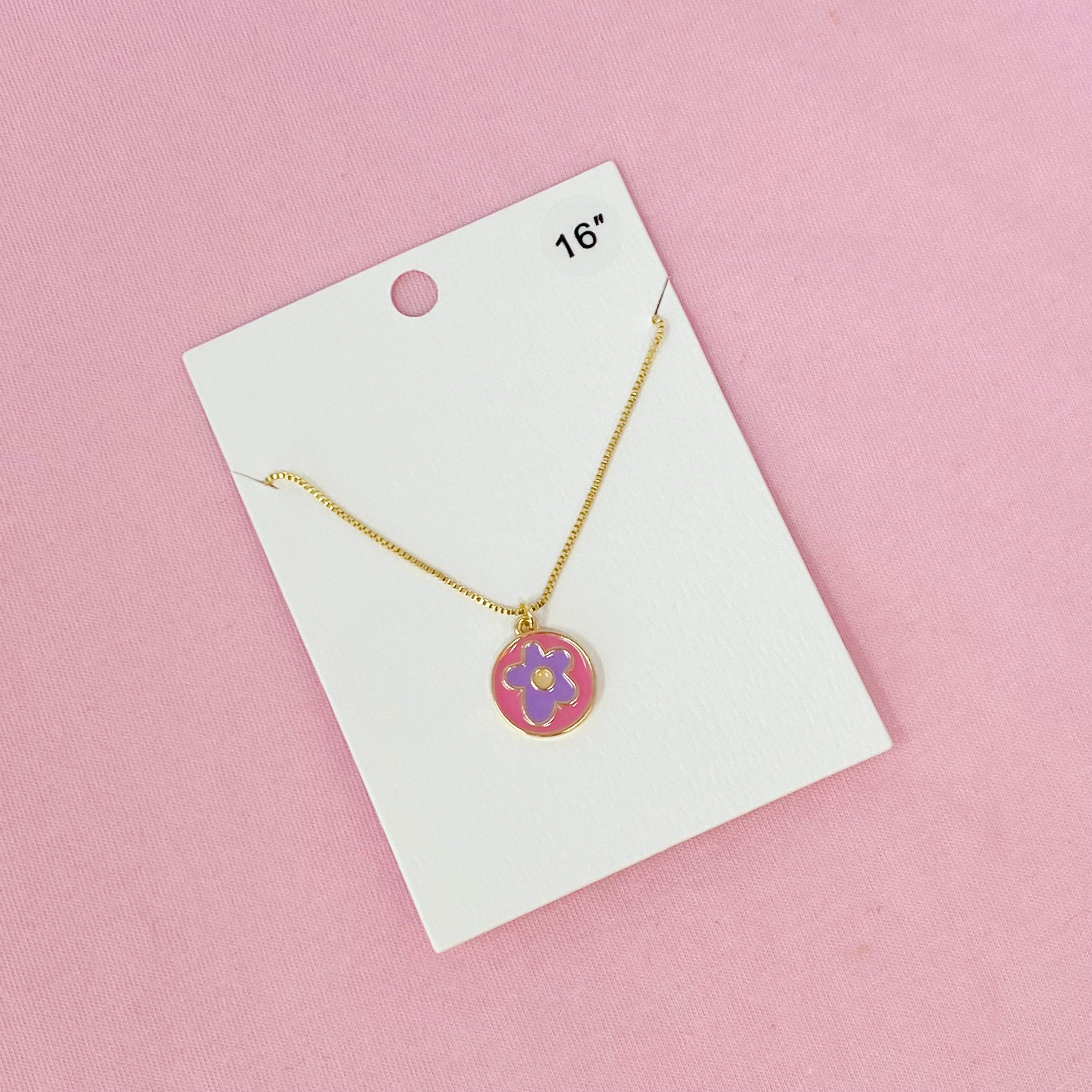 A delicate Flower Lover Necklace featuring a colorful flower pendant on a gold plated chain.