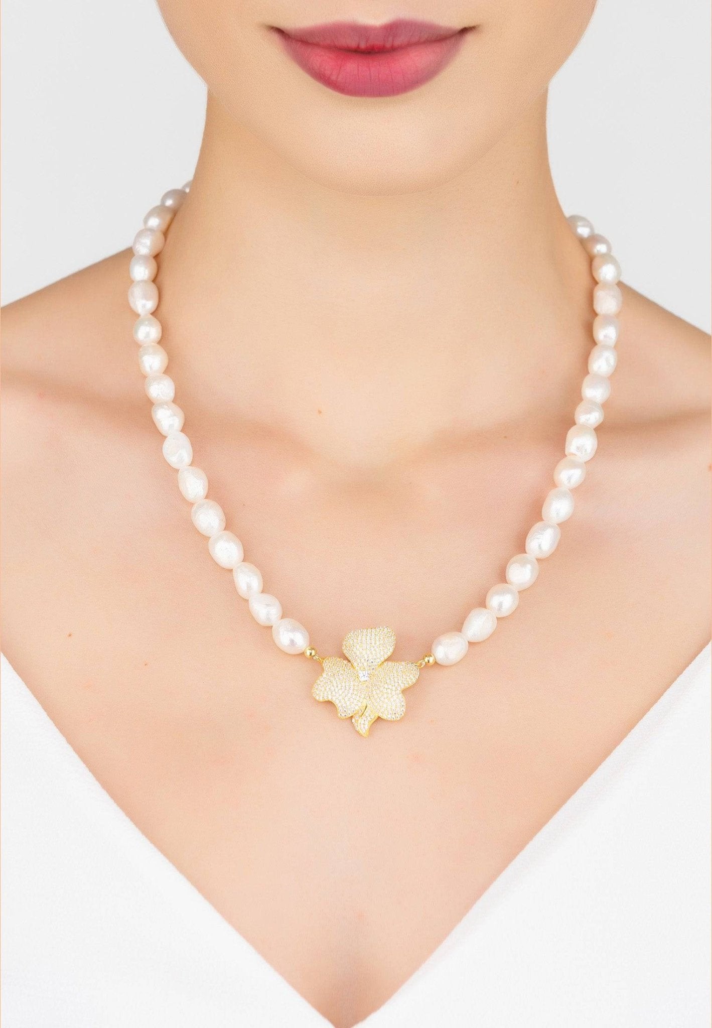 Flower Pearl Mid Length Necklace featuring natural Tiffany pearls and a zirconia-encrusted flower motif, elegantly displayed in a jewelry box.