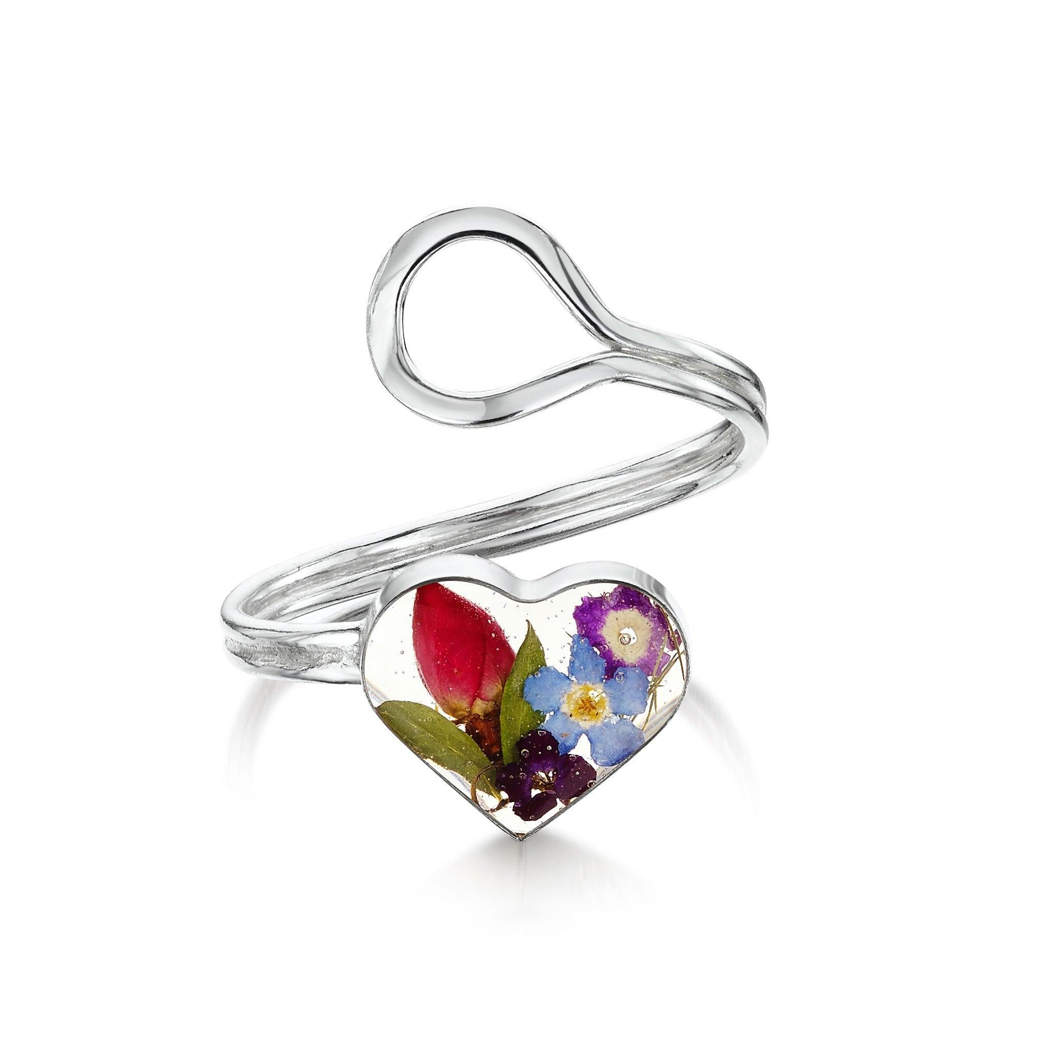 Flower ring by Shrieking Violet, featuring real flowers in a sterling silver adjustable design, elegantly displayed in a gift box.