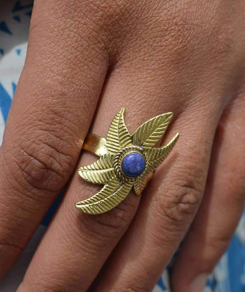 A beautiful Flower Ring featuring a unique floral design, crafted from hypoallergenic brass and silver, perfect for festivals and everyday wear.