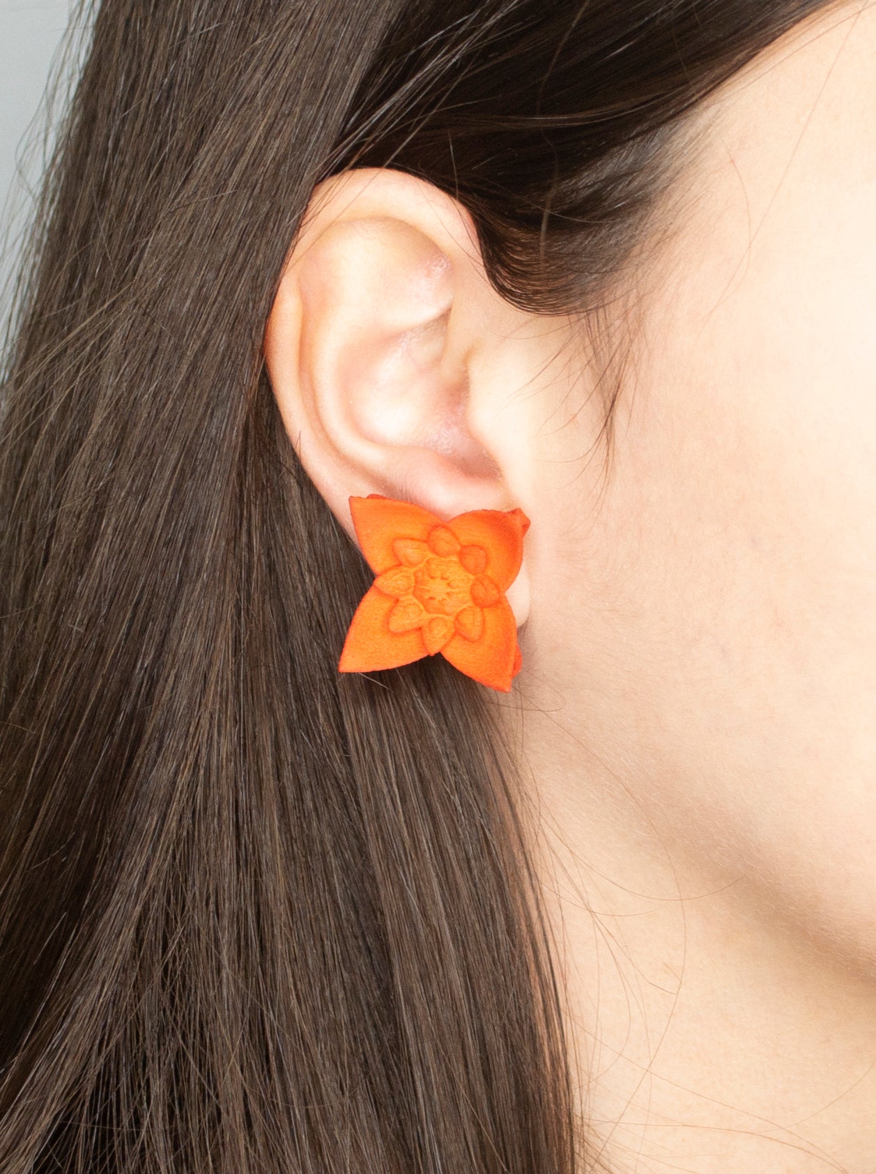 A pair of Dahlia Flower Stud Earrings featuring a floral design in vibrant colors, made from nylon and sterling silver.