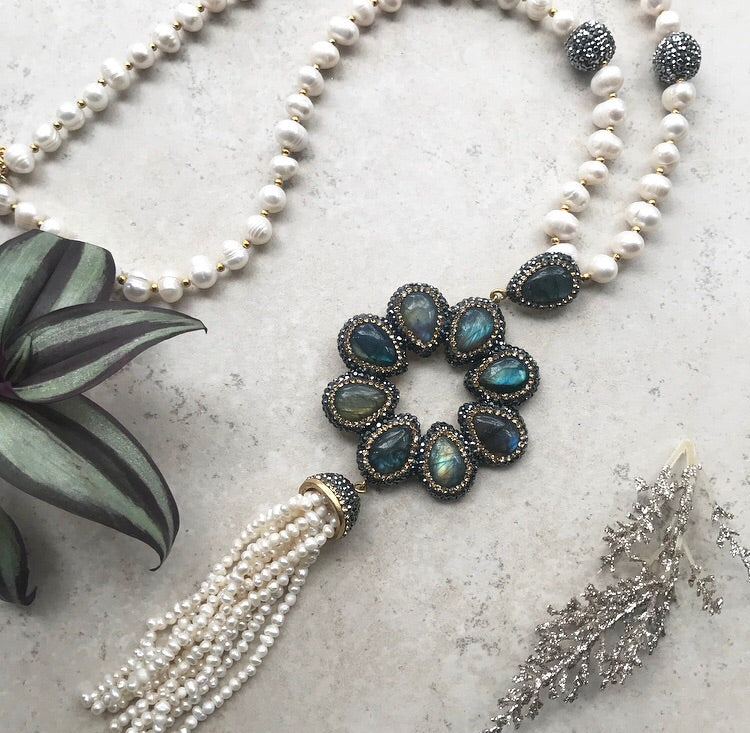 Elegant FLOWER Tassel Necklace featuring brass and yellow gold plating with labradorite stones, showcasing a stylish tassel design.