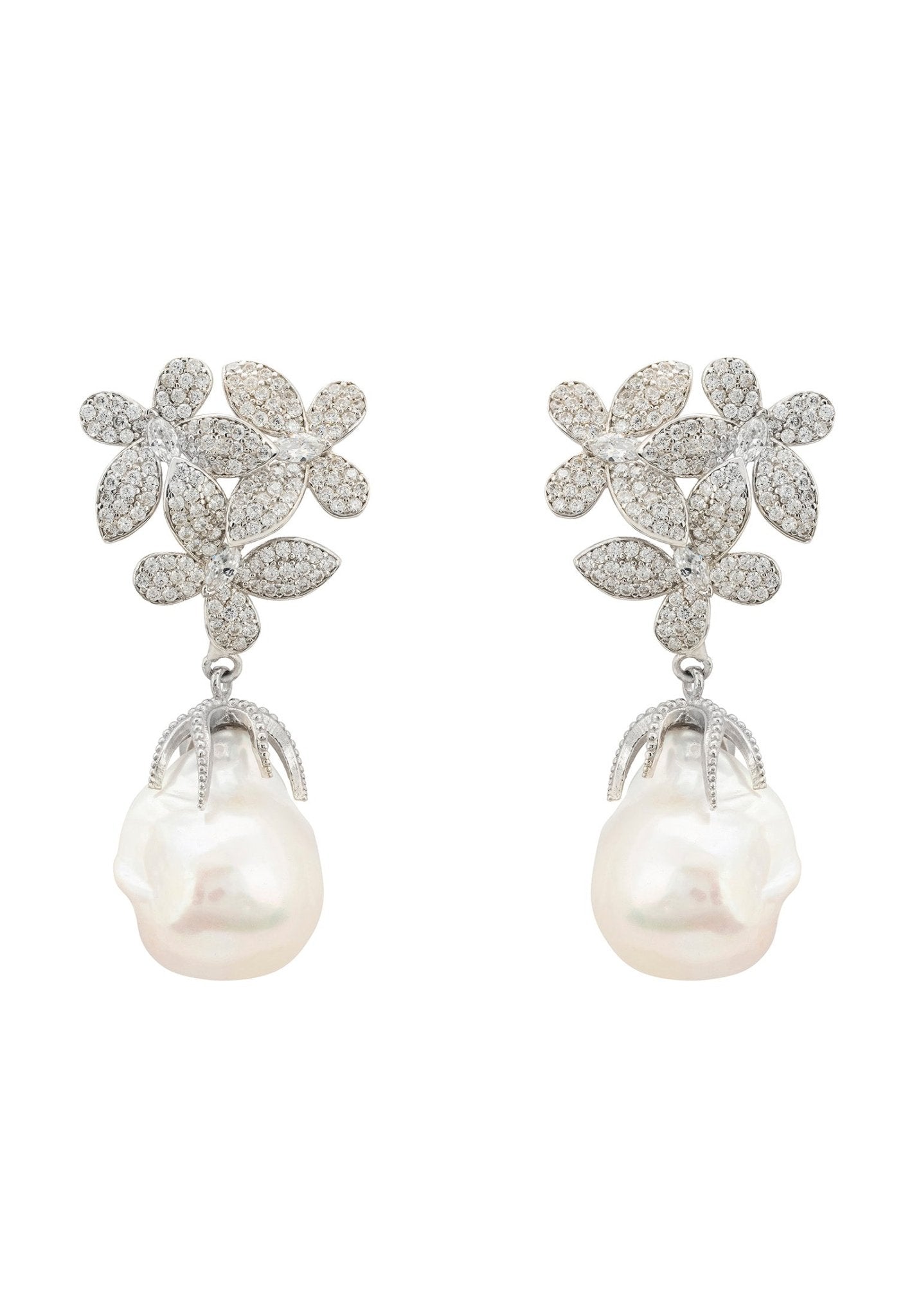 A pair of elegant silver earrings featuring floral designs with cubic zirconia and dangling baroque pearls, showcasing sophistication and charm.