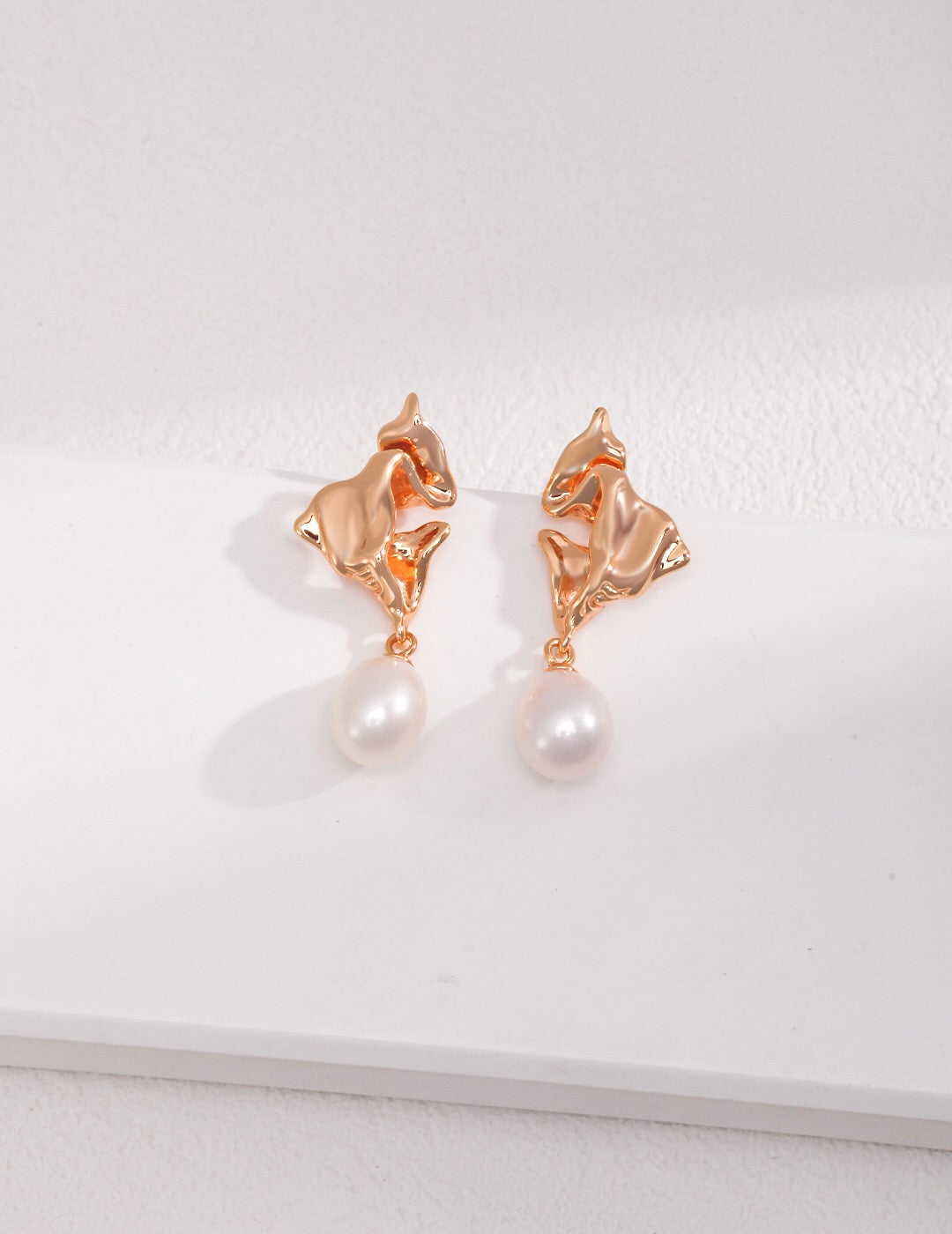 Fluid Elegance Pearl Earrings featuring natural pearls and gold vermeil, elegantly designed for a sophisticated look.