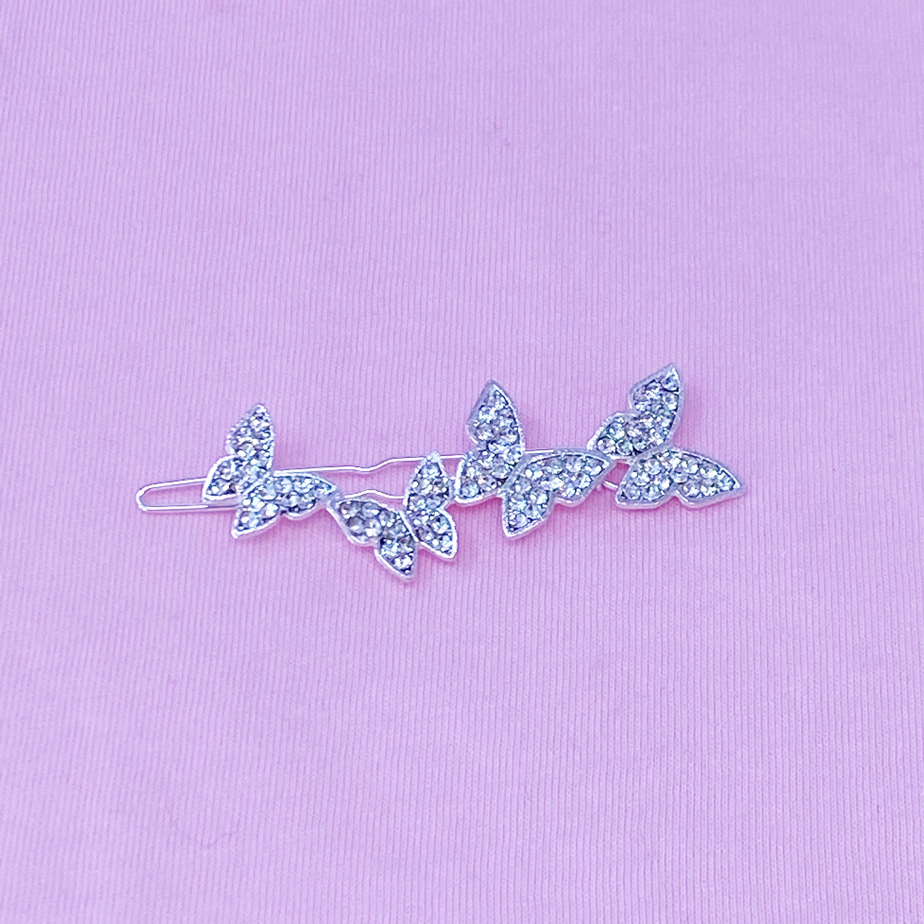 A beautifully crafted butterfly-shaped hair clip adorned with sparkling cubic zirconia, showcasing elegance and style.