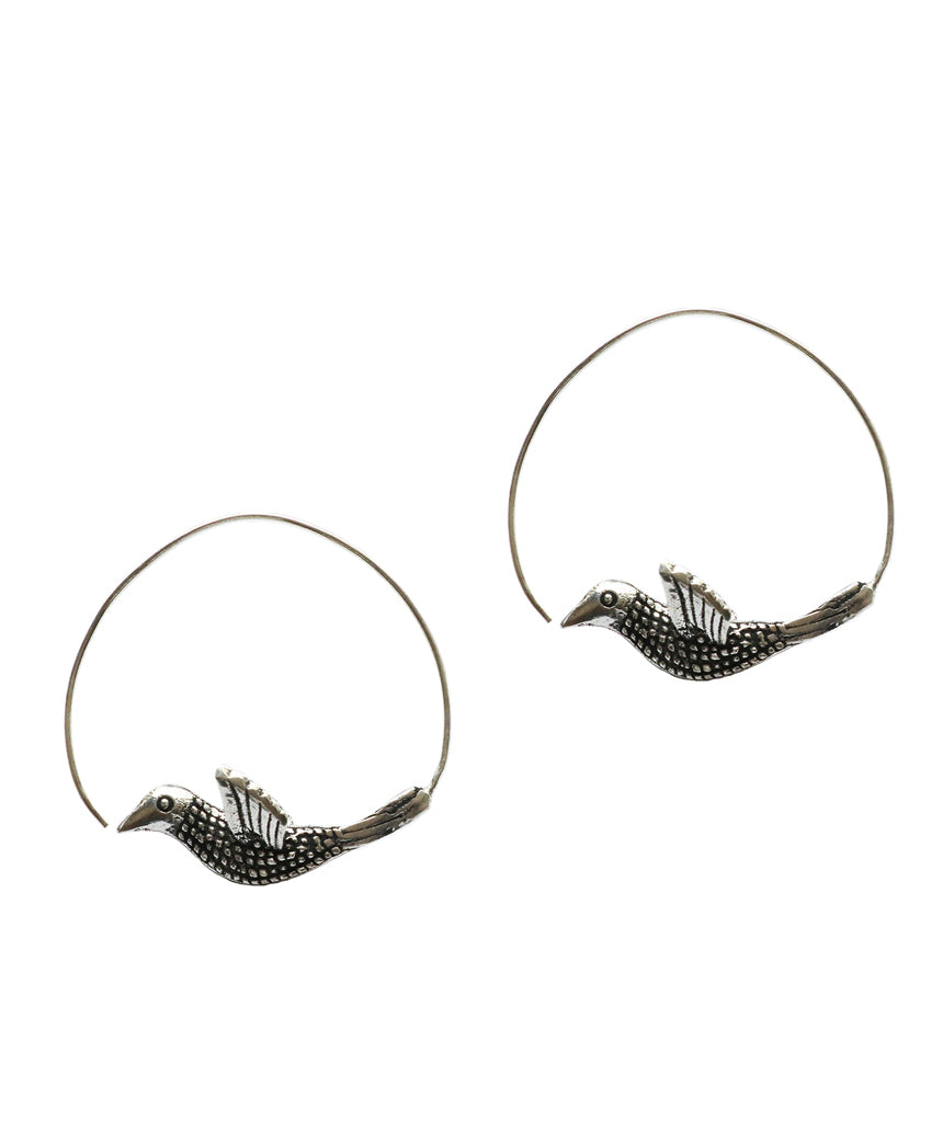 A pair of stunning Flying Bird Statement Earrings in brass with intricate hand-carved designs, showcasing a shiny finish, perfect for festivals.