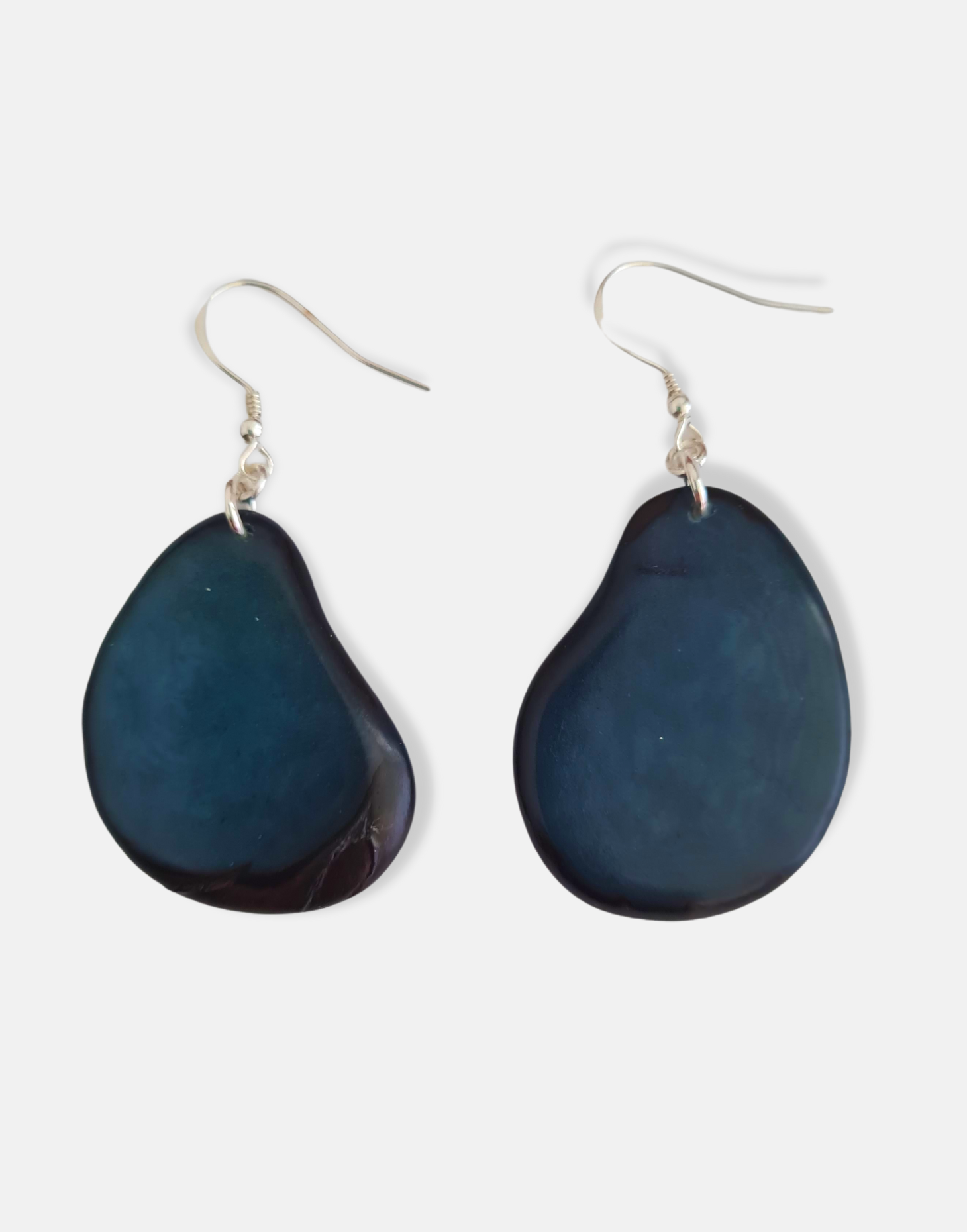 A pair of Folha Tagua Nut Earrings made from vegetable ivory with sterling silver hooks, showcasing unique natural textures and colors.