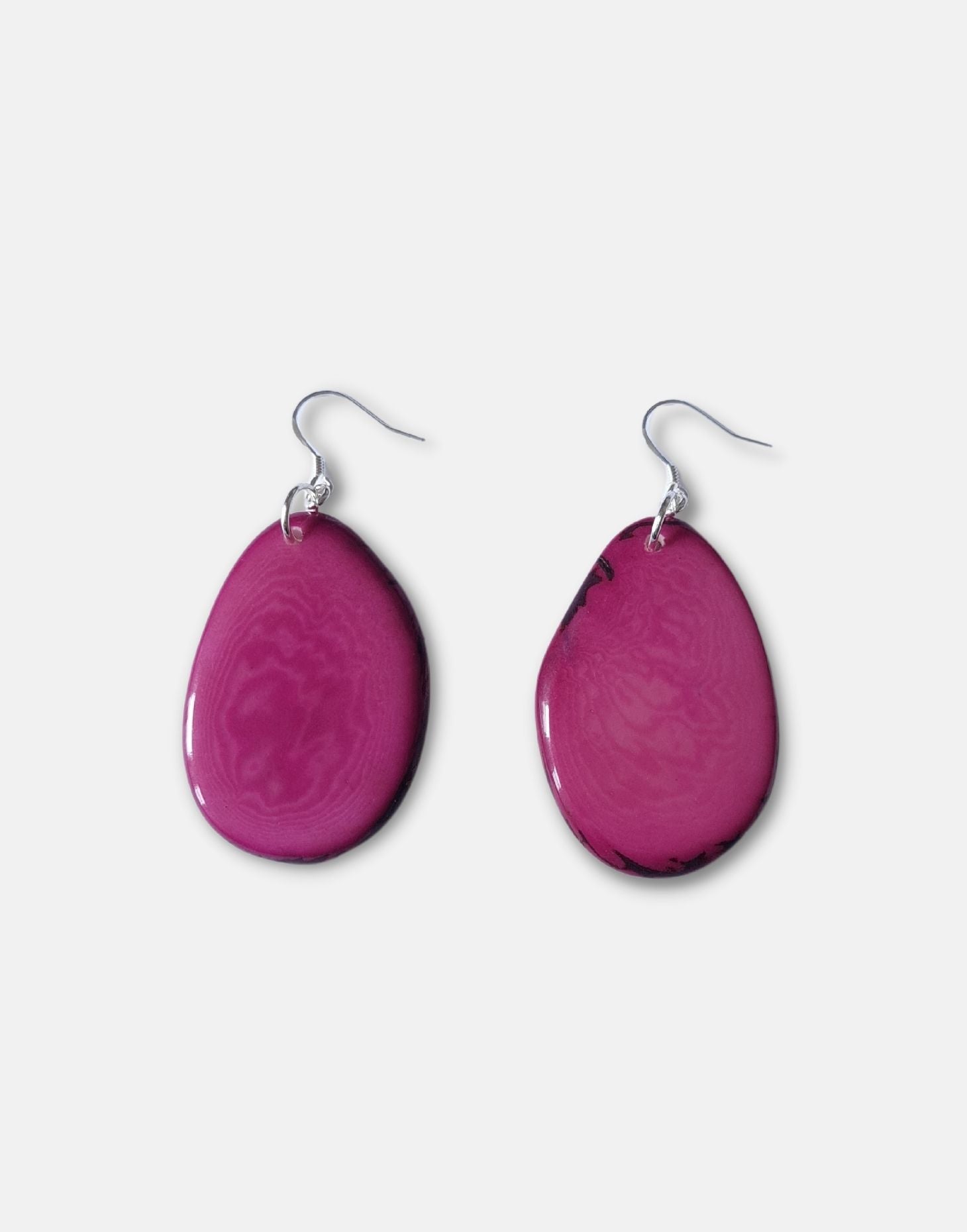 A pair of Folha Tagua Nut Earrings made from vegetable ivory with sterling silver hooks, showcasing unique natural textures and colors.