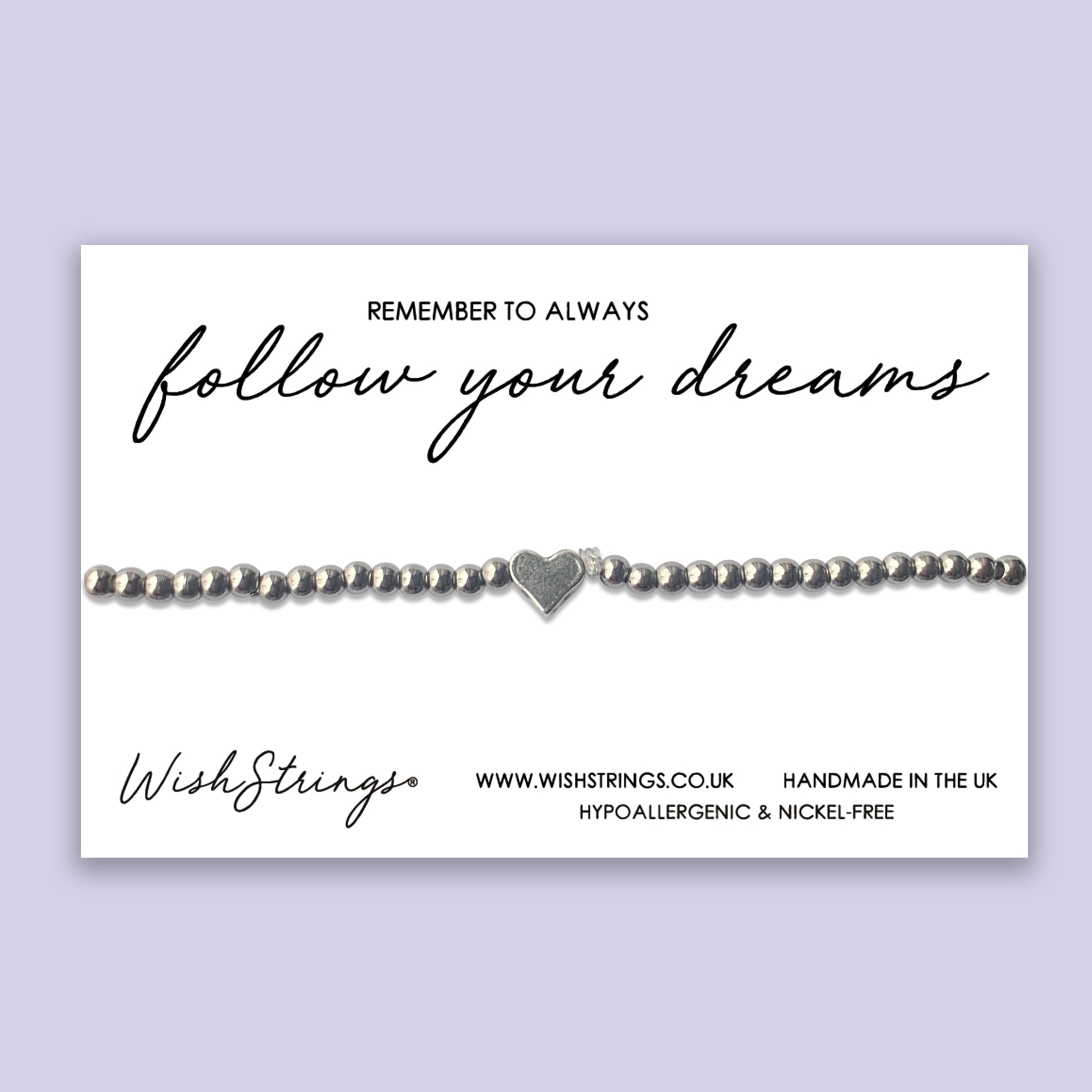 Follow Your Dreams Heart Stretch Bracelet, handmade with silver-coated beads, presented on a gift card.