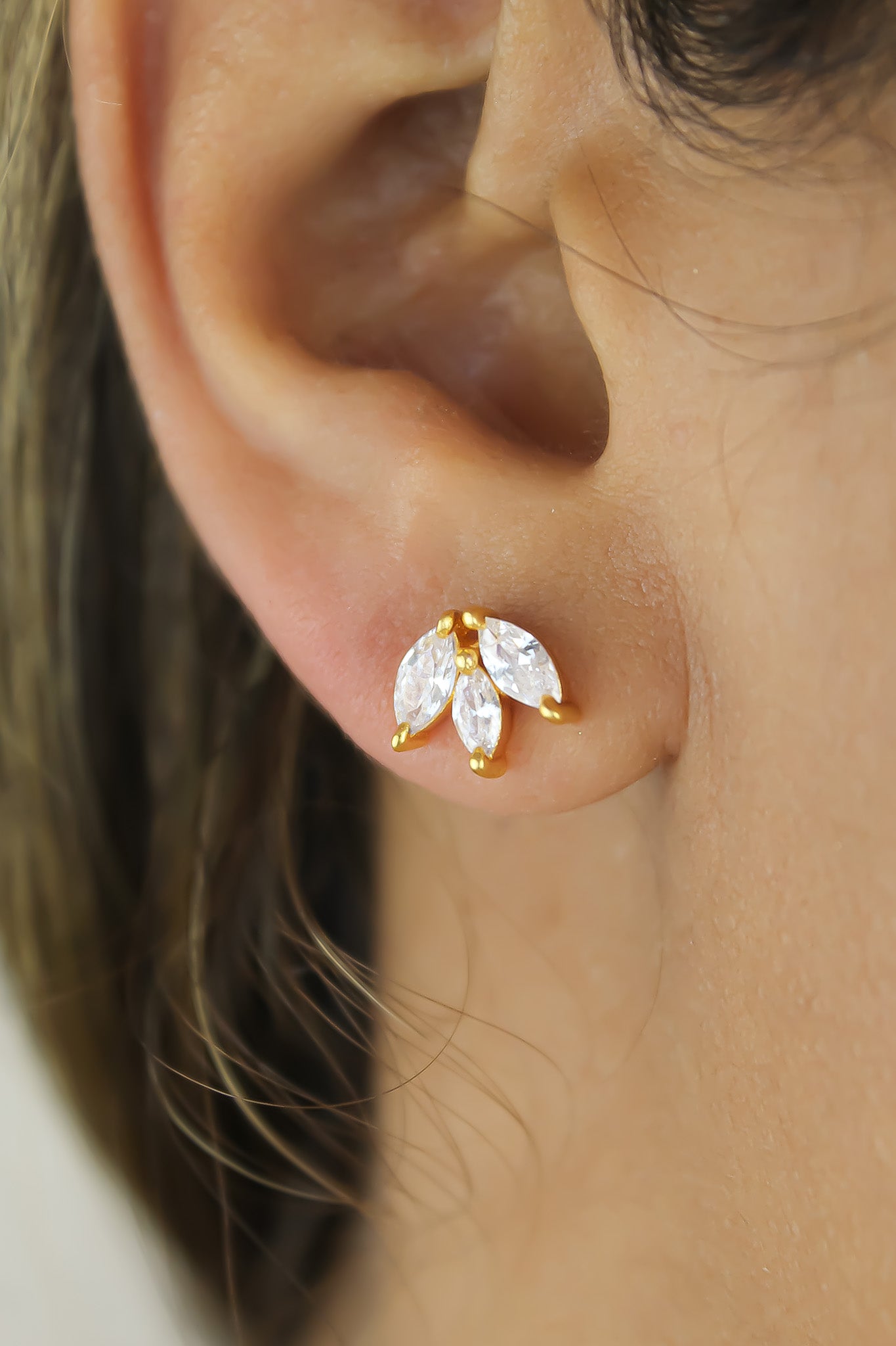 Elegant Fontana Earrings featuring 18K gold plating and three marquise-cut zirconia stones, perfect for sensitive ears.