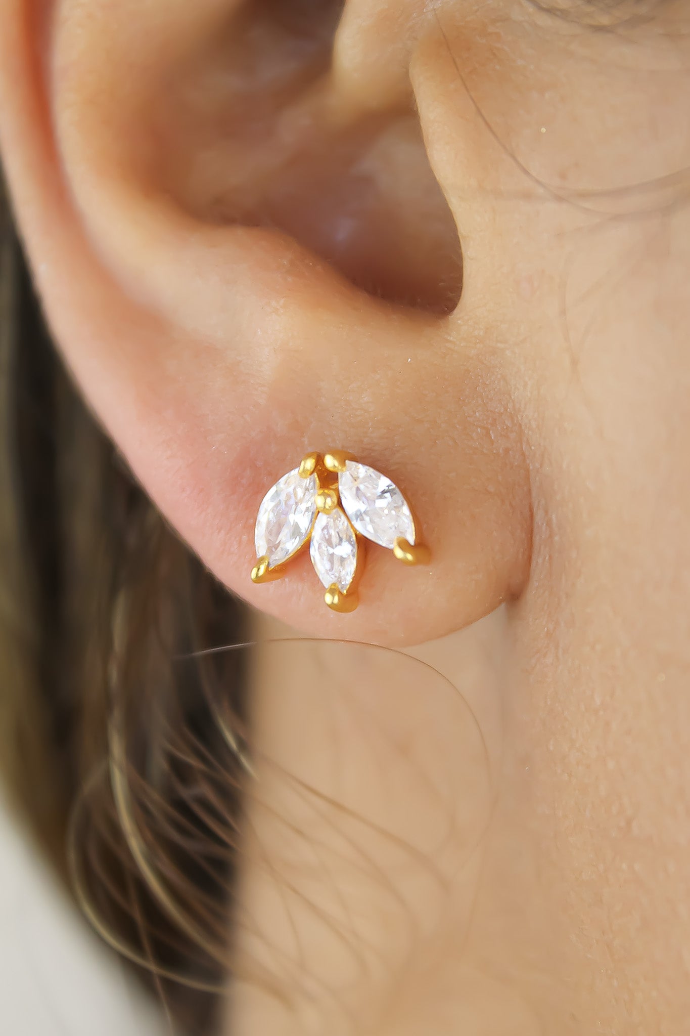 Elegant Fontana Earrings featuring 18K gold plating and three marquise-cut zirconia stones, perfect for sensitive ears.