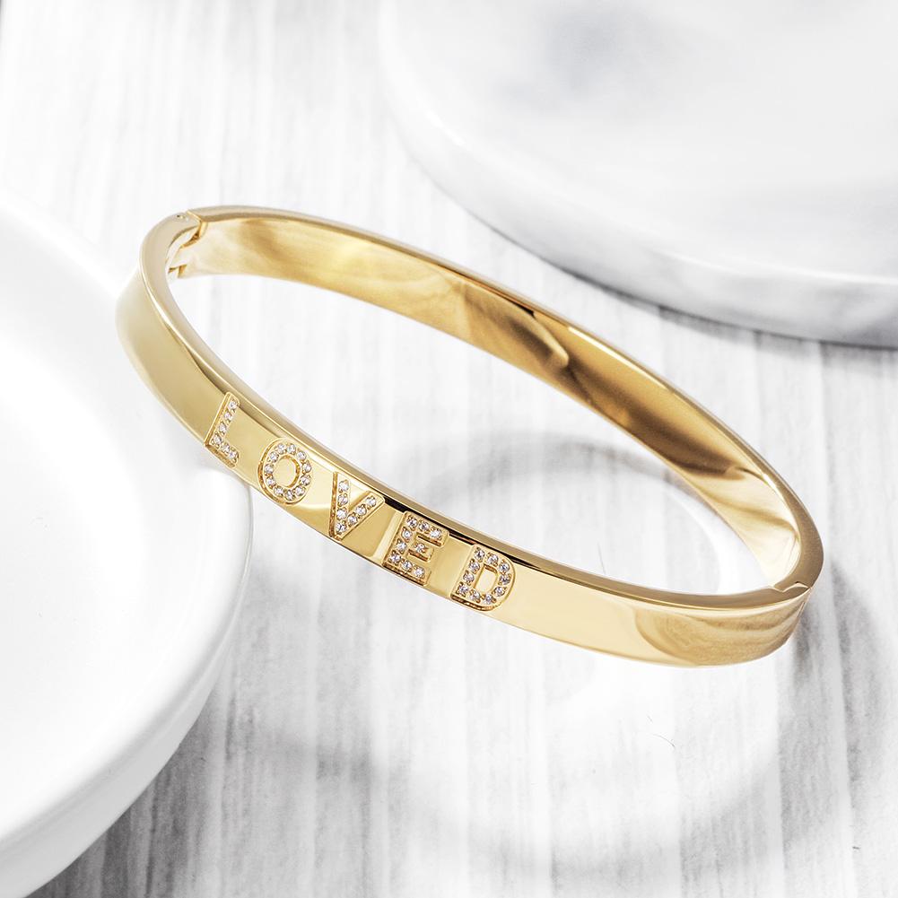 A beautiful Forever Loved Bangle Bracelet made of 316L surgical stainless steel with 14K gold PVD plating, showcasing its elegant design.