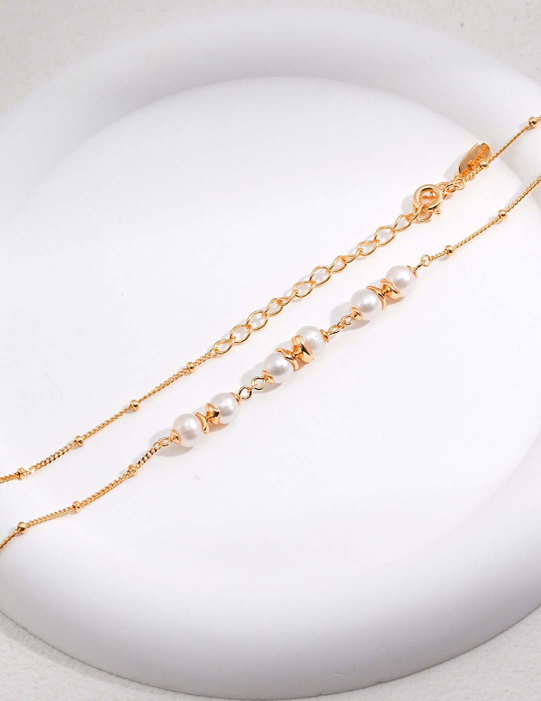 A beautifully handcrafted Freshwater Pearl Beads Spacer Necklace featuring natural pearls and gold vermeil accents, elegantly displayed on a soft background.