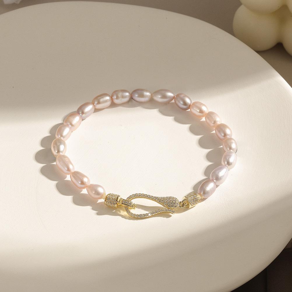 A stunning Freshwater Pearl Bracelet made from real pearls and hypo-allergenic sterling silver, elegantly displayed on a soft background.