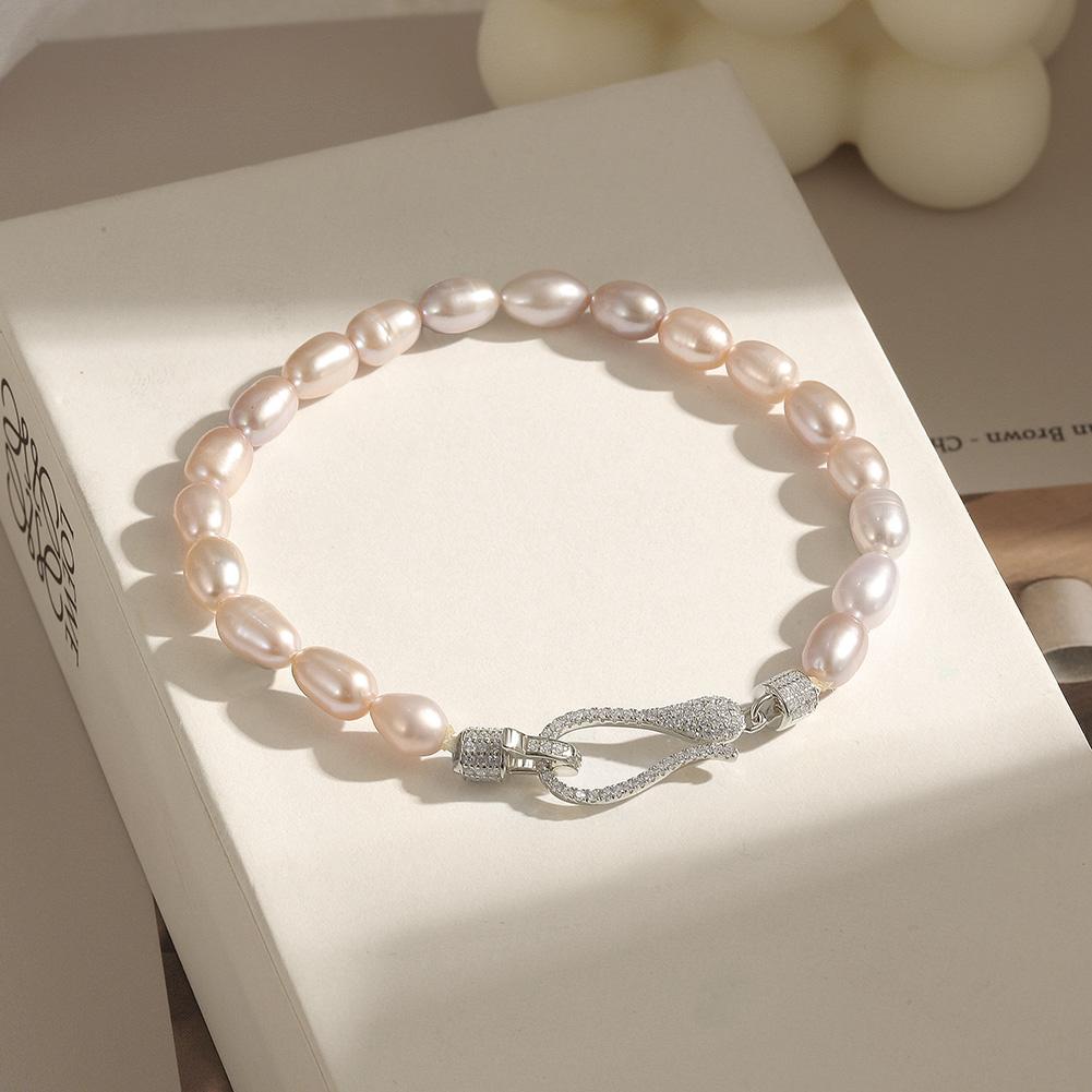 A stunning Freshwater Pearl Bracelet made from real pearls and hypo-allergenic sterling silver, elegantly displayed on a soft background.