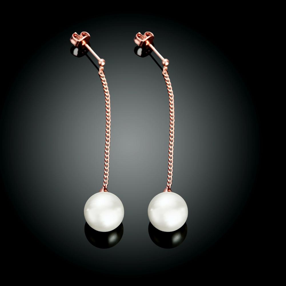 Elegant freshwater pearl dangling link earrings in 18K rose gold plating, showcasing a modern design.