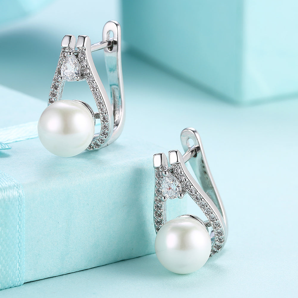 Elegant freshwater pearl leverback earrings in 18K white gold plating, showcasing their luxurious design and hypoallergenic features.